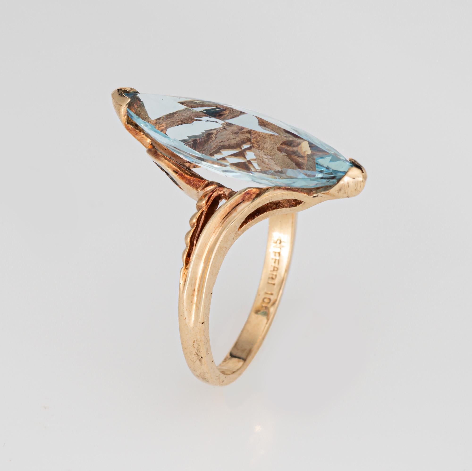 Elegante anello cocktail vintage con acquamarina realizzato in oro giallo 10 carati (circa anni '80). 

L'acquamarina taglio marquise misura 22 mm x 8 mm (stima 4,50 carati). L'acquamarina è in ottime condizioni e non presenta crepe o scheggiature. 