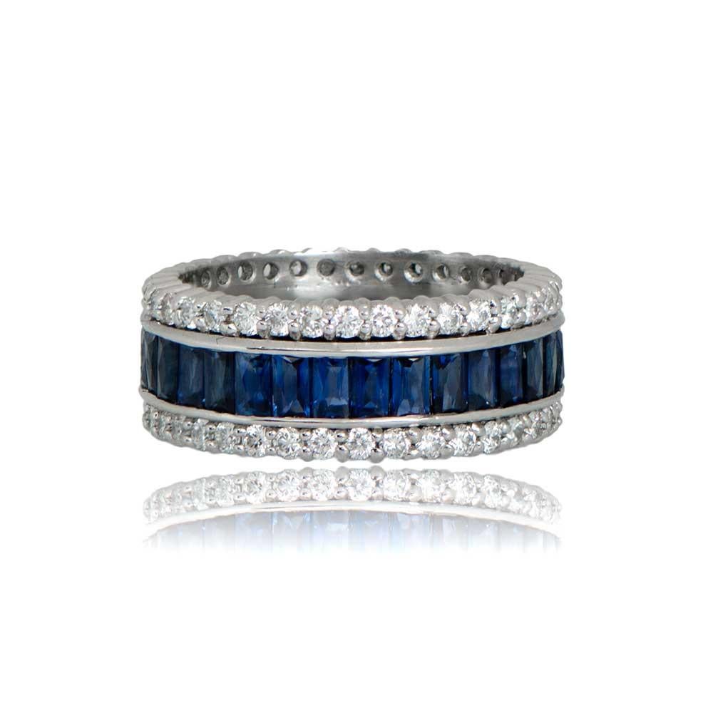 An exquisite wedding band showcases a row of channel-set French-cut natural sapphires, bordered by shared prong-set diamonds on each side. The band boasts an approximate diamond weight of 2.00 carats and a total sapphire weight of 4.50 carats.

Ring