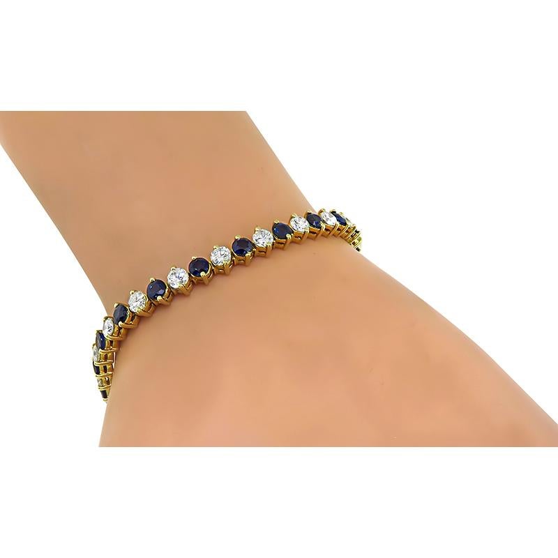 This is an elegant 14k yellow gold bracelet. The bracelet is set with sparkling round cut diamonds that weigh approximately 3.50ct. The color of these diamonds is G-H with VS2 clarity. The diamonds are accentuated by lovely round cut sapphires that