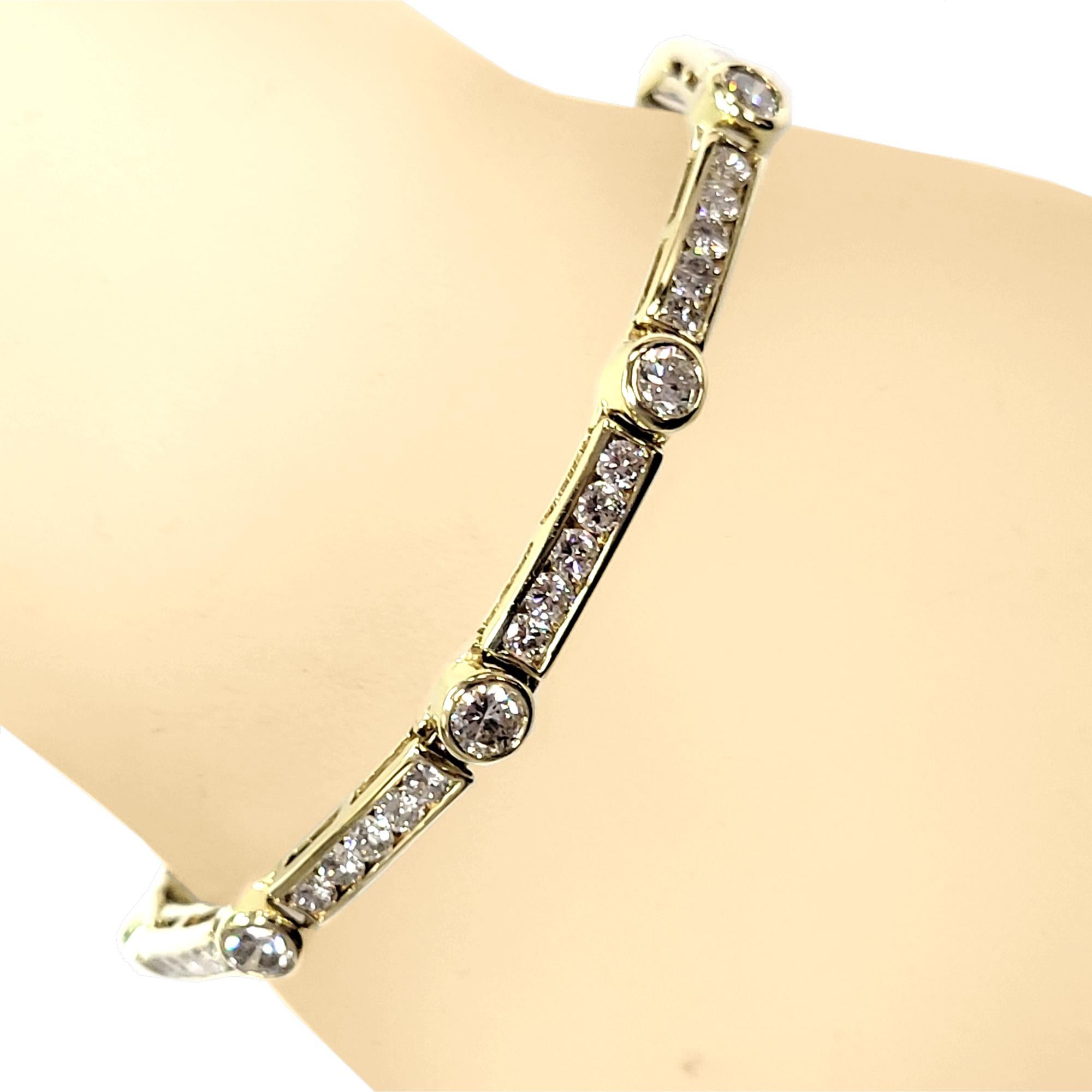 This Diamond Bracelet consists of 9 Links comprising of 9 Bezels Set with 3.5 mm Round Brilliant diamonds and p bars Pave Set with 45 2.7 mm Round Brilliant diamonds . The bracelet is made in 14K Yellow Gold.  The bracelet comes with a built in lock