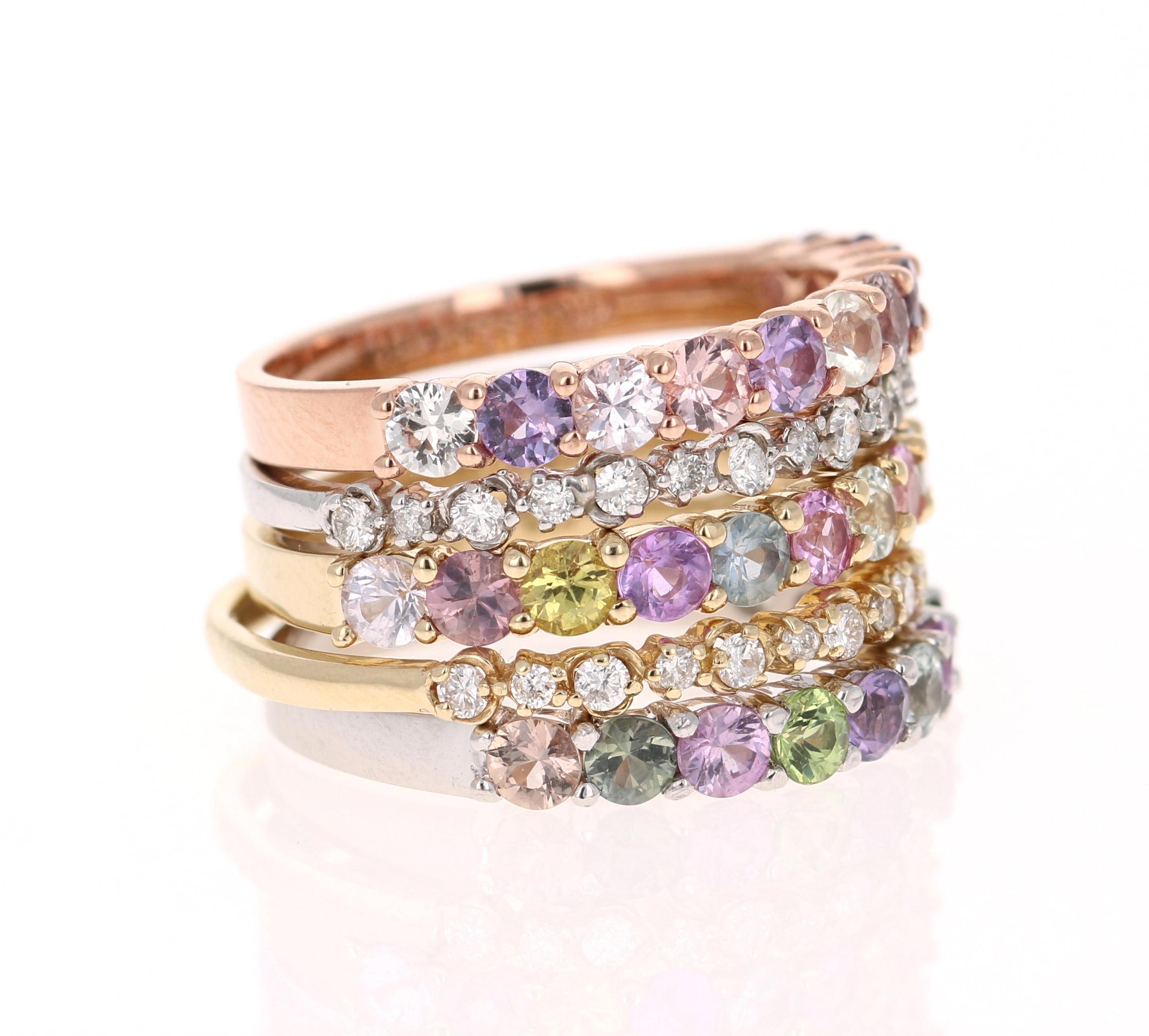 This is a set of 5 Bands and the description is as follows:

3 Multicolored Sapphire Bands = 33 Multi Colored Sapphires weighing 4.04 Carats 
2 Round Cut Diamond Bands = 30 Round Cut Diamonds weighing 0.46 Carats (Clarity: SI2, Color: F)
14K Gold