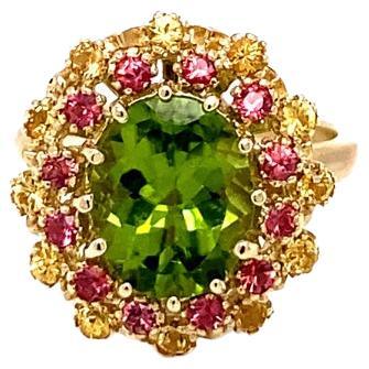 4.51 Carat Peridot Yellow and Red Sapphire 14 Karat Yellow Gold Cocktail Ring For Sale