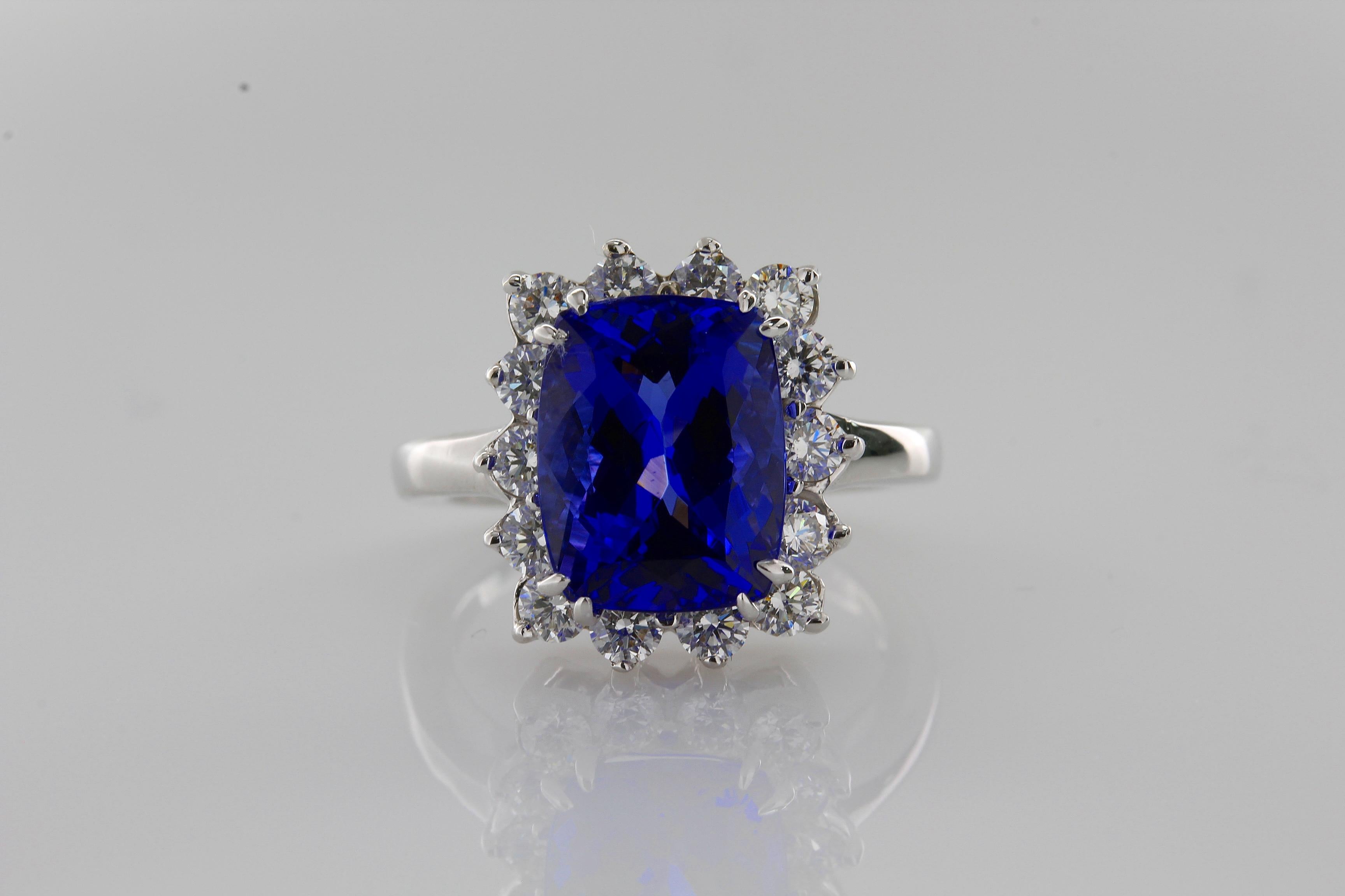 Incredible Deal on 4.52 Carat Cushion Cut Violet Blue Natural Tanzanite Gemstone mounted in a 14 Karat White Gold Ring.
Total Carat Weight on the ring is 5.49
The beautiful, classic and simple design on this ring makes this large Cushion Blue