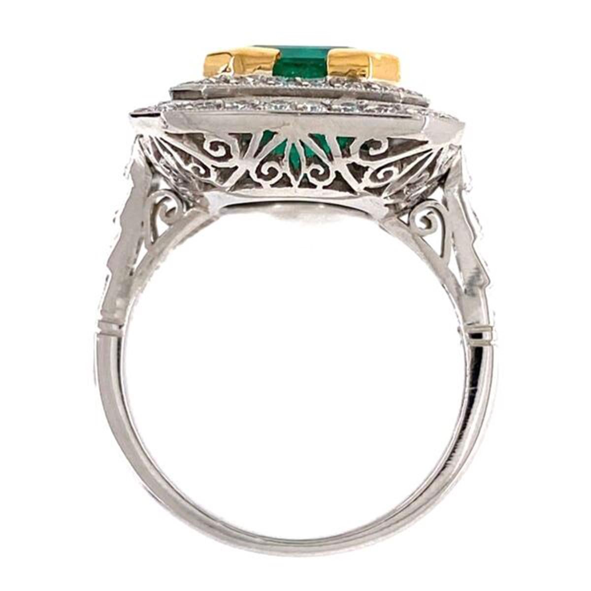 Elegant & finely detailed Solitaire Cocktail Engagement Ring, set with a securely nestled 4.52 Carat Emerald Cut Emerald, weighing approx. 4.52 Carats, surrounded by and extending to the shoulders, Brilliant-cut Diamonds, weighing approx. 1.05 total