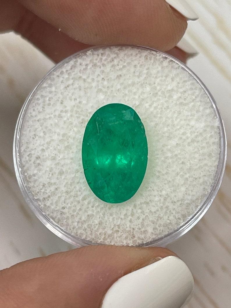 Stone: Emerald
Weight: 4.52-carats
Shape: Oval Cut
Clarity: Semi-Transparent
Luster: Very Good-Good
Color: Medium Green
Measurements: 13.30mm x 8.82mm x 7.01mm
Geographic Origin: Colombia
Treatment: Natural, Oiling

Comments: Due to their growth