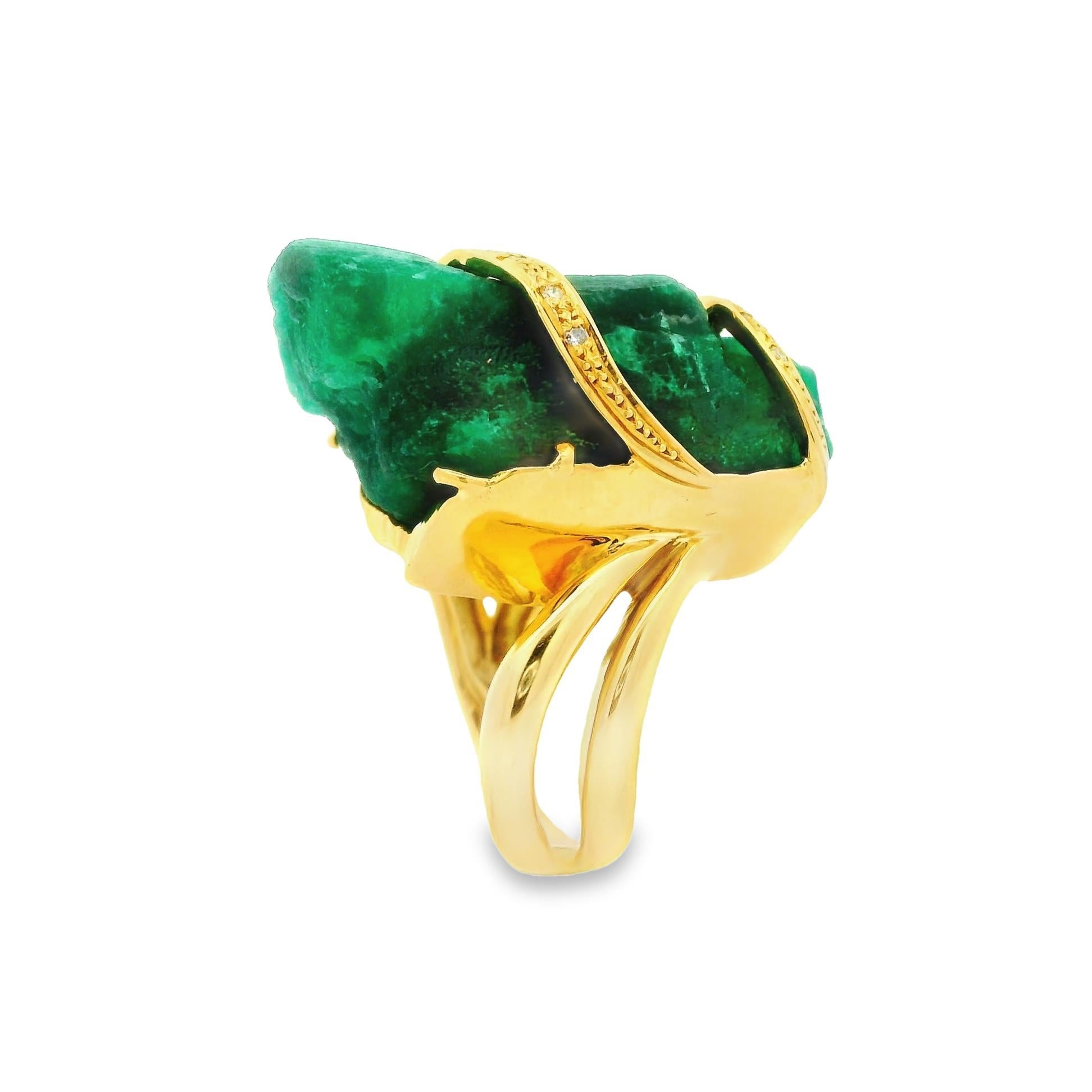 This massive 45.26 carat Emerald Crystal has been dough from the ground and set in the ring in its natural unpolished form! The unpolished and uncut emerald is for ring collectors who prefer a unique one-of-a-kind piece to wear. 18K yellow gold is