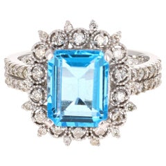 Bague en or blanc 14 carats avec topaze bleue de 4,53 carats et diamants