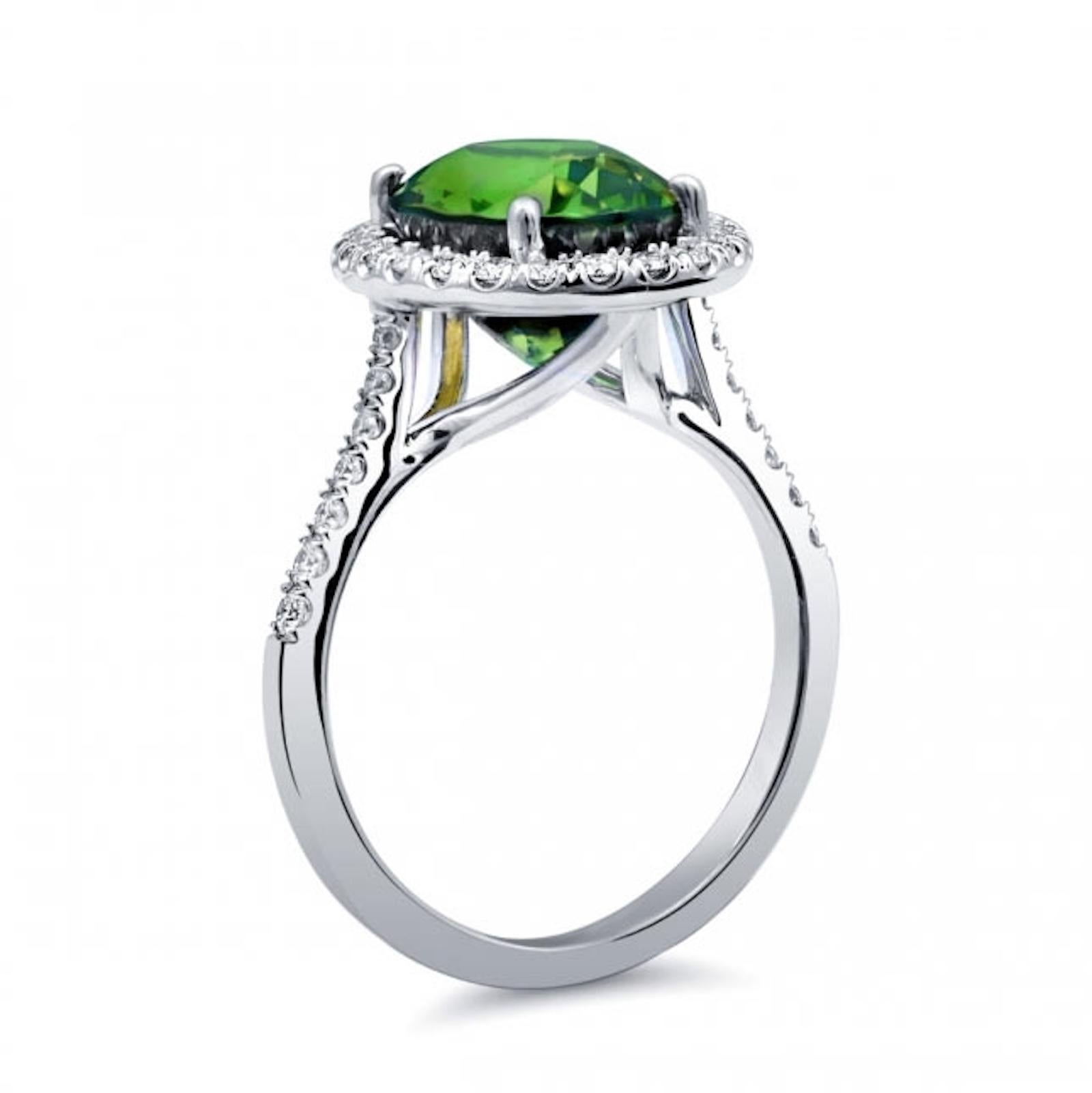 A masterpiece of elegance and natural beauty. Our 14K White Gold Ring features a stunning 4.53-carat Natural Green Tourmaline, exuding strong color intensity and very eye-clean clarity. Accented by 0.39 carats of Diamonds, this ring is a symbol of