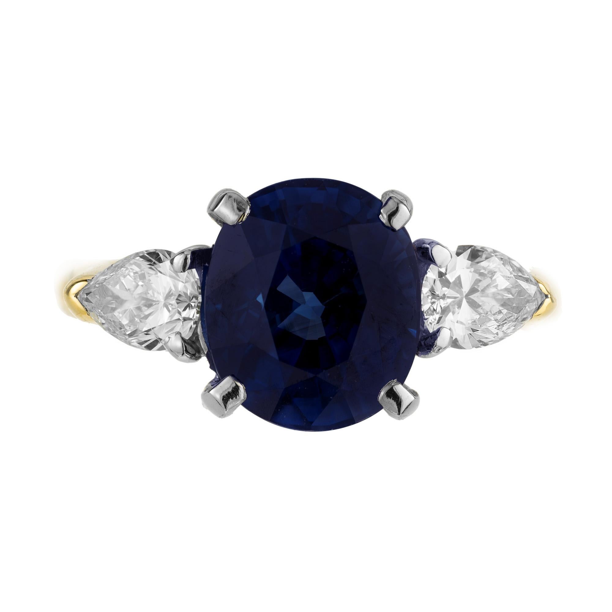 Natural no heat royal blue fine 4.53 carat oval Sapphire and pear shaped diamond engagement ring. In its original handmade 18k yellow gold and platinum setting. The two pear shaped diamond side stones are the perfect match to accent the beautiful