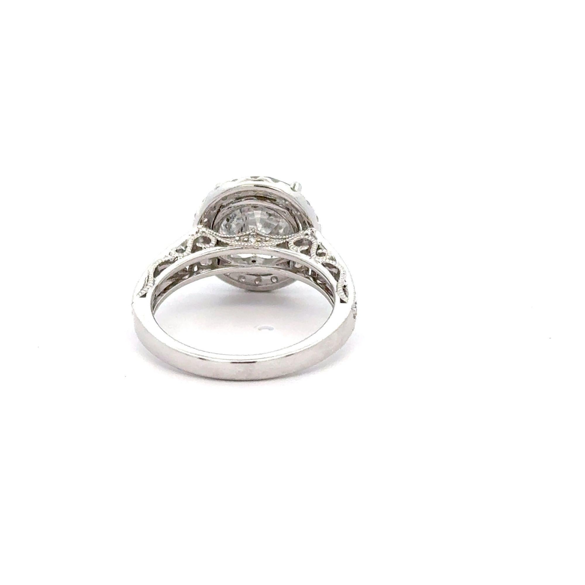 EGL Certified 4.53 Carat Round Cut Natural Diamond 18K White Gold Floral Shank and Round Halo Engagement Ring.

Details:
Item Type: Engagement Ring
Metal: 18K White Gold
Size: 7
Weight: 5.80 grams

Center Stone Details:
Type: Natural Diamond
Carat: