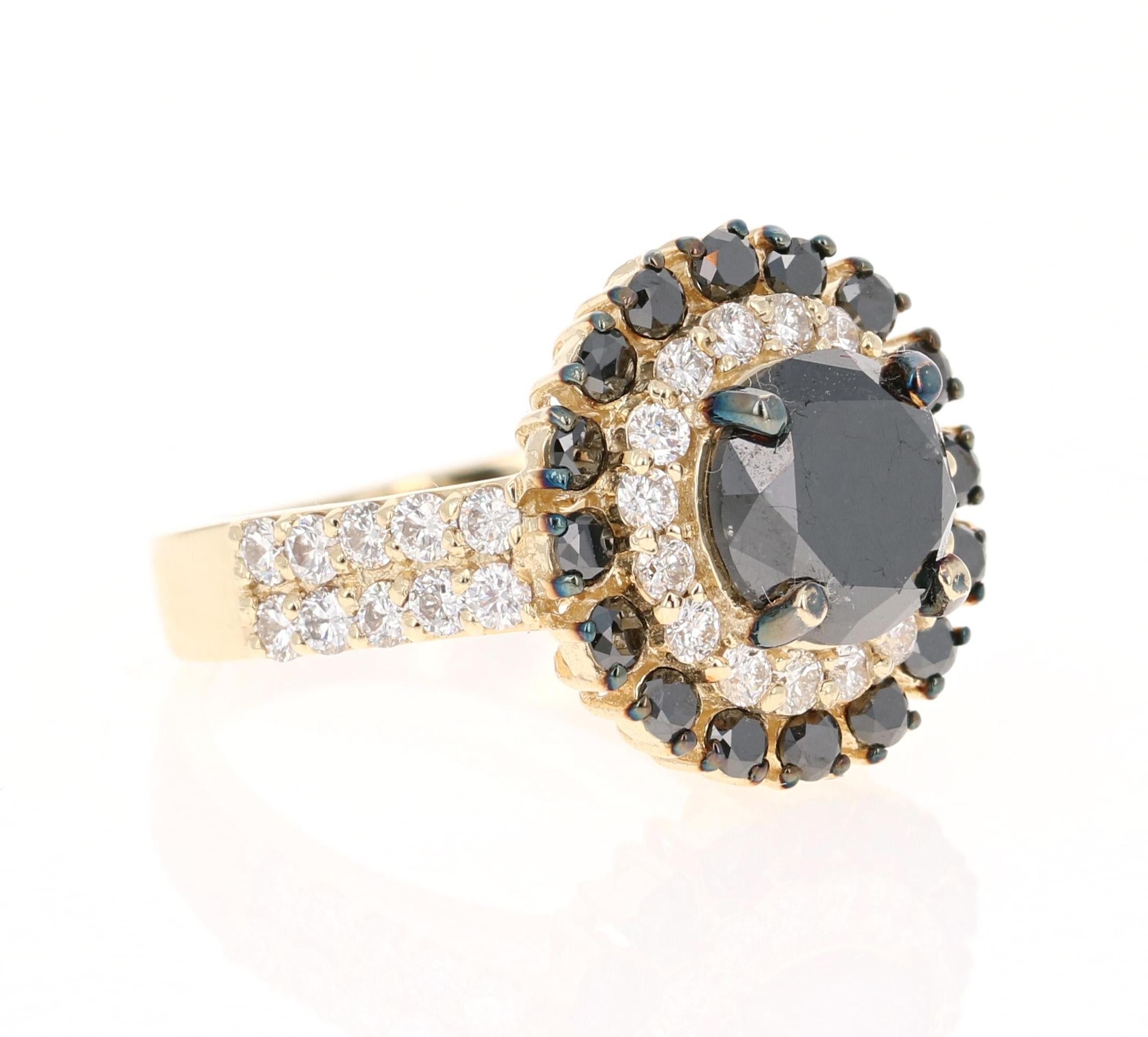 This Black and White Diamond Ring is the most unique and beautiful Engagement Ring!

The Round Cut Black Diamond is 2.79 Carats and its gorgeous setting holds 16 Black Round Cut Diamonds weighing 0.75 Carats and 36 Round Cut Diamonds that weigh 1.00