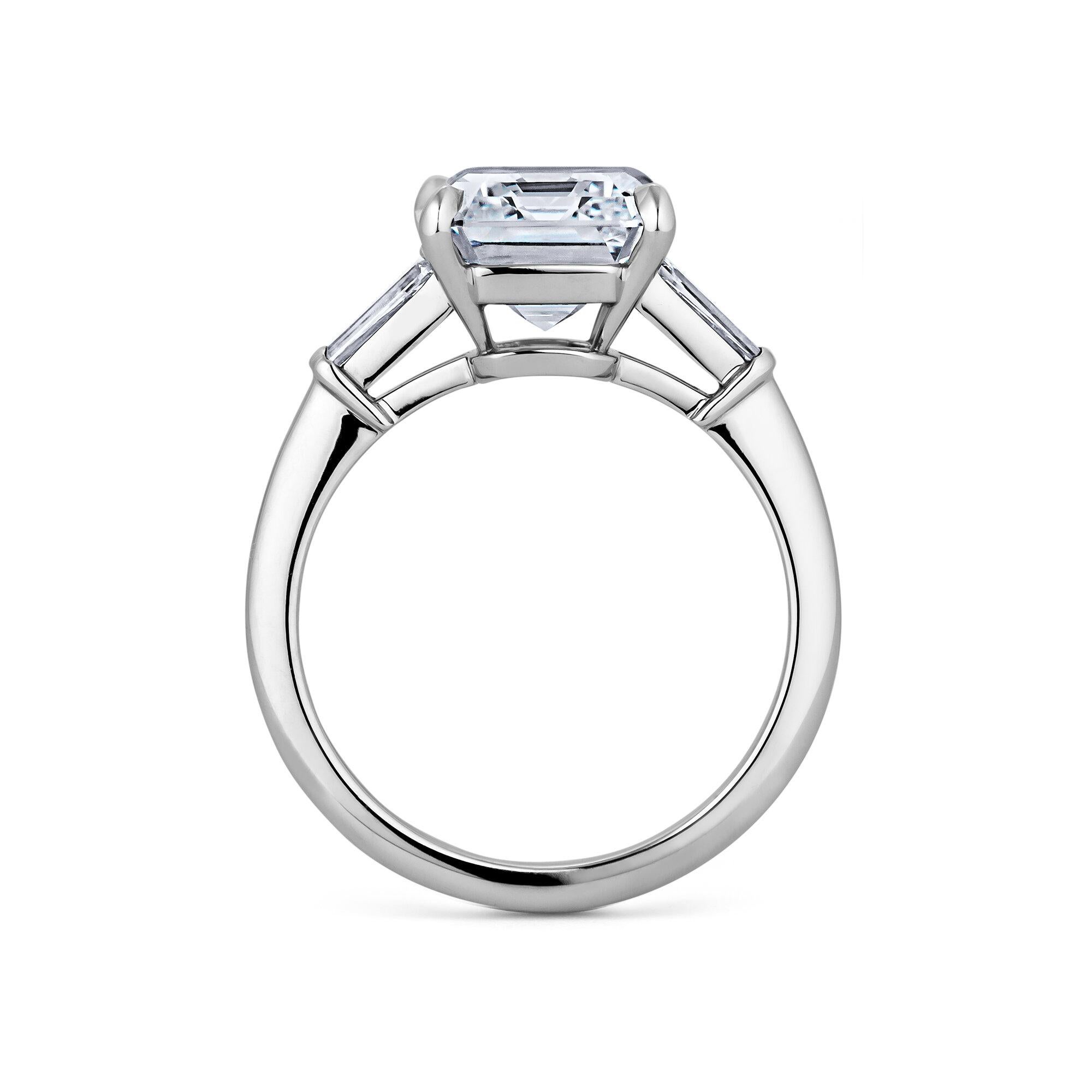 Clear, cool, and white as ice, this 4.54 carat emerald cut diamond engagement ring sparkles with extraordinary inner light.  With a rare D color Type IIA classification, this exceptional diamond ring is scintillatingly collectible.  GIA