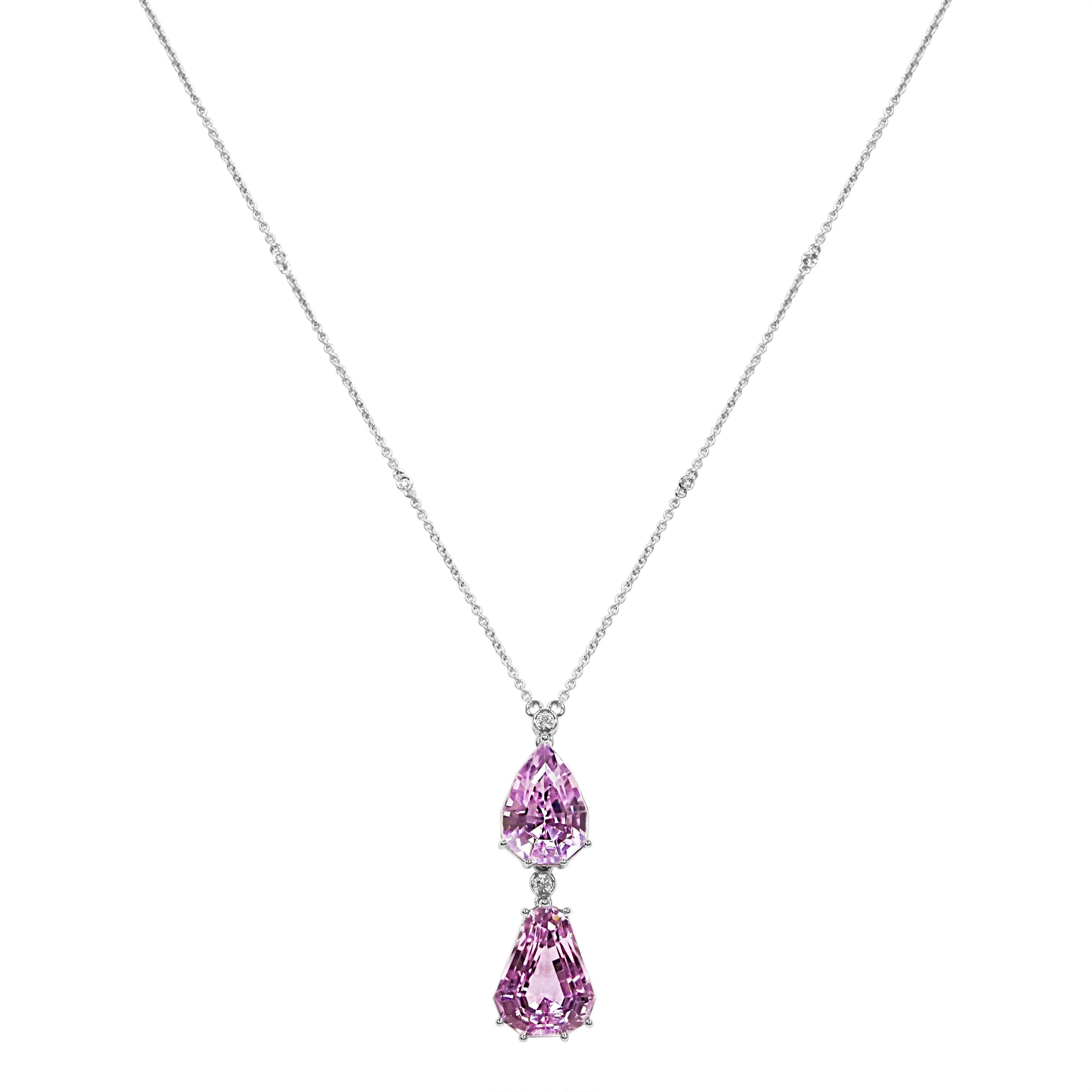 2 Kunzite Gemstones: 45.25 Carats
6 White Diamonds: 0.23 Carat, Round Cut
Metal: 18K White Gold, 9 Grams