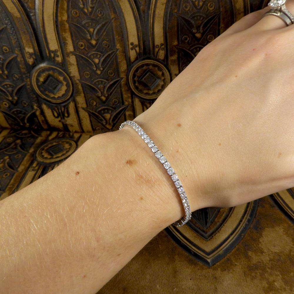 This luxurious Tennis bracelet has been crafted in 18ct White Gold. Featuring a collection of modern brilliant cut Diamonds which add sentiment, all finished with a diamond set v snap box clasp and fold over safety clasp for peace of mind. Such a