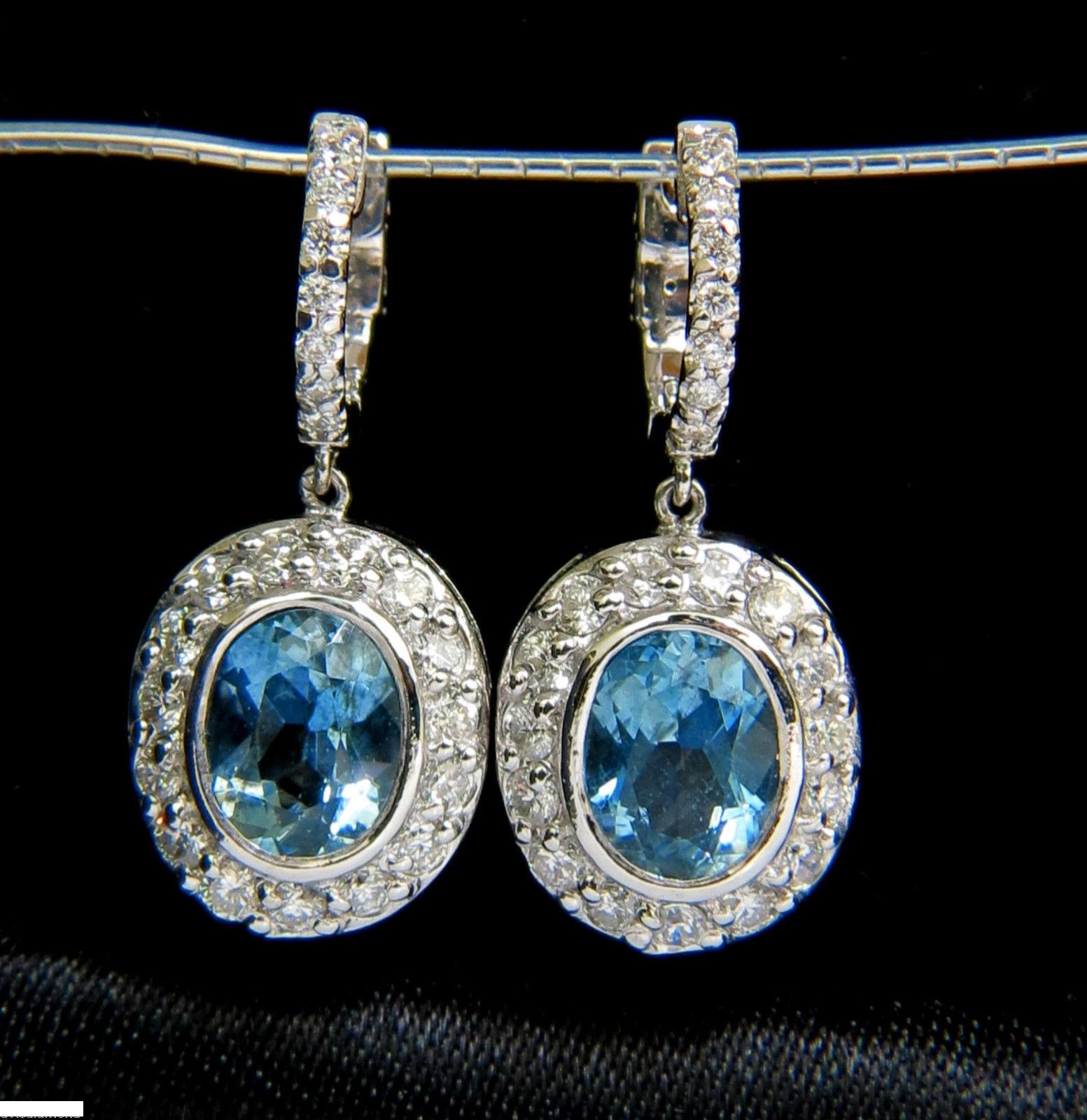 3.35ct. Natural Aquamarines

Gorgeous Aqua Color / sparkles

Clean Clarity and Excellent transparency 

8.0mm X 6.2mm



1.20ct. diamonds

G-color, Vs-2 clarity

14kt. white gold

8.8 grams

Cluster portion of earrings:

15.30 X 13.20mm

Entire
