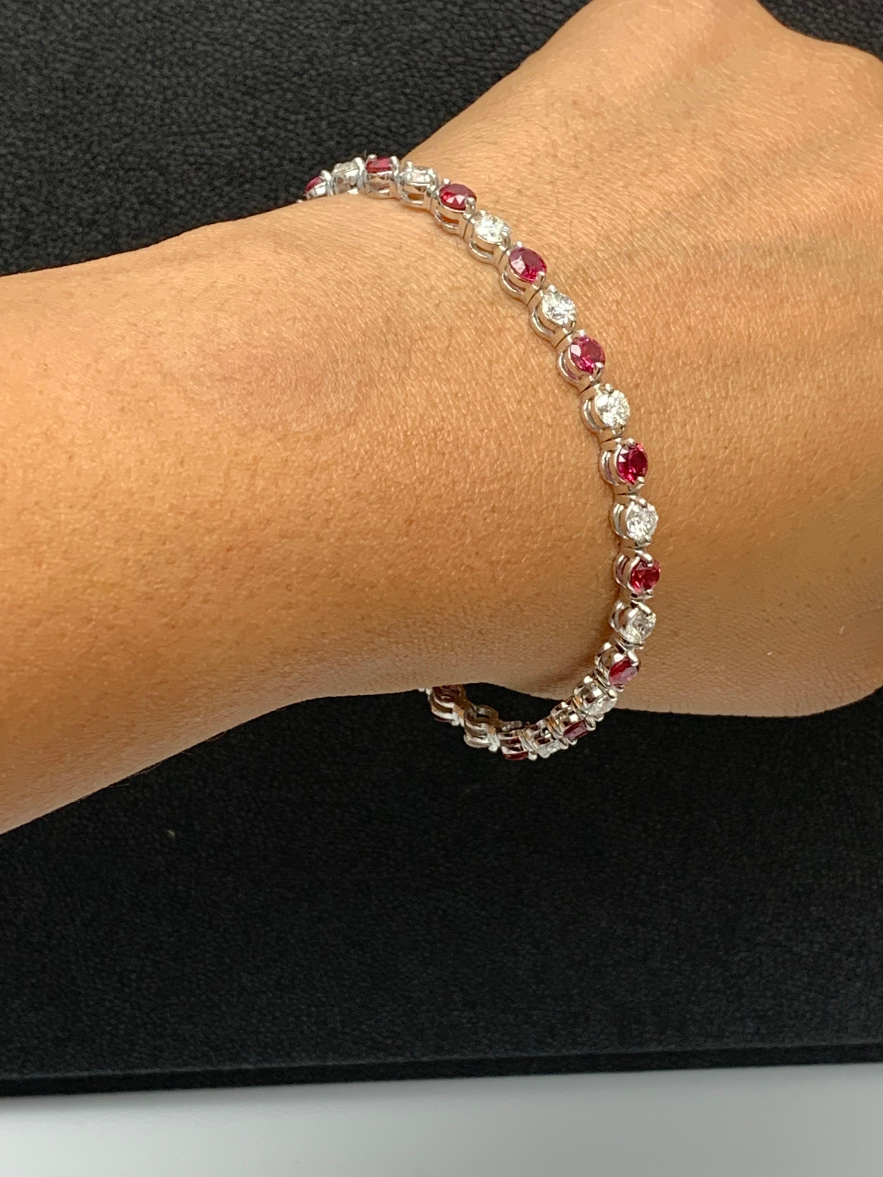 A stunning bracelet set with 16 Vibrant Red Rubies weighing 4.55 carat total. Alternating these rubies are 16 sparkling round diamonds weighing 3.92 carats in total. Set in polished 14k white gold. Double lock mechanism for maximum security. A