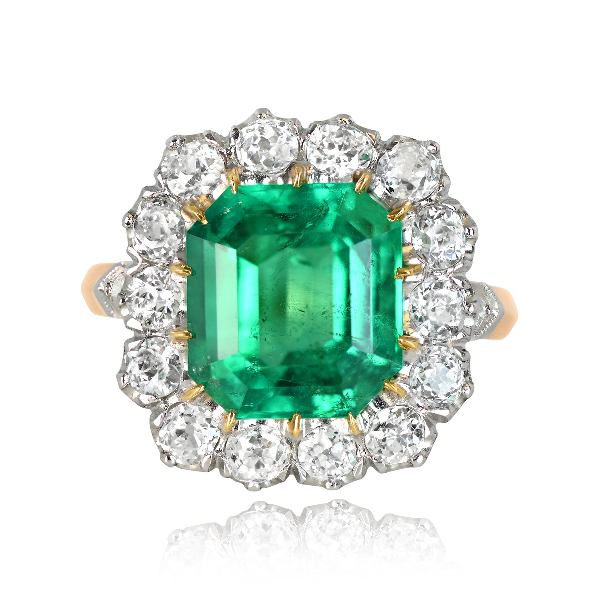 This is a stunning 4.55ct Colombian emerald cluster ring with old European cut diamonds. The emerald is GIA-certified. There is an additional halo of approx 1.50ct diamonds surrounding the center stone. This ring is handcrafted in platinum and 18k