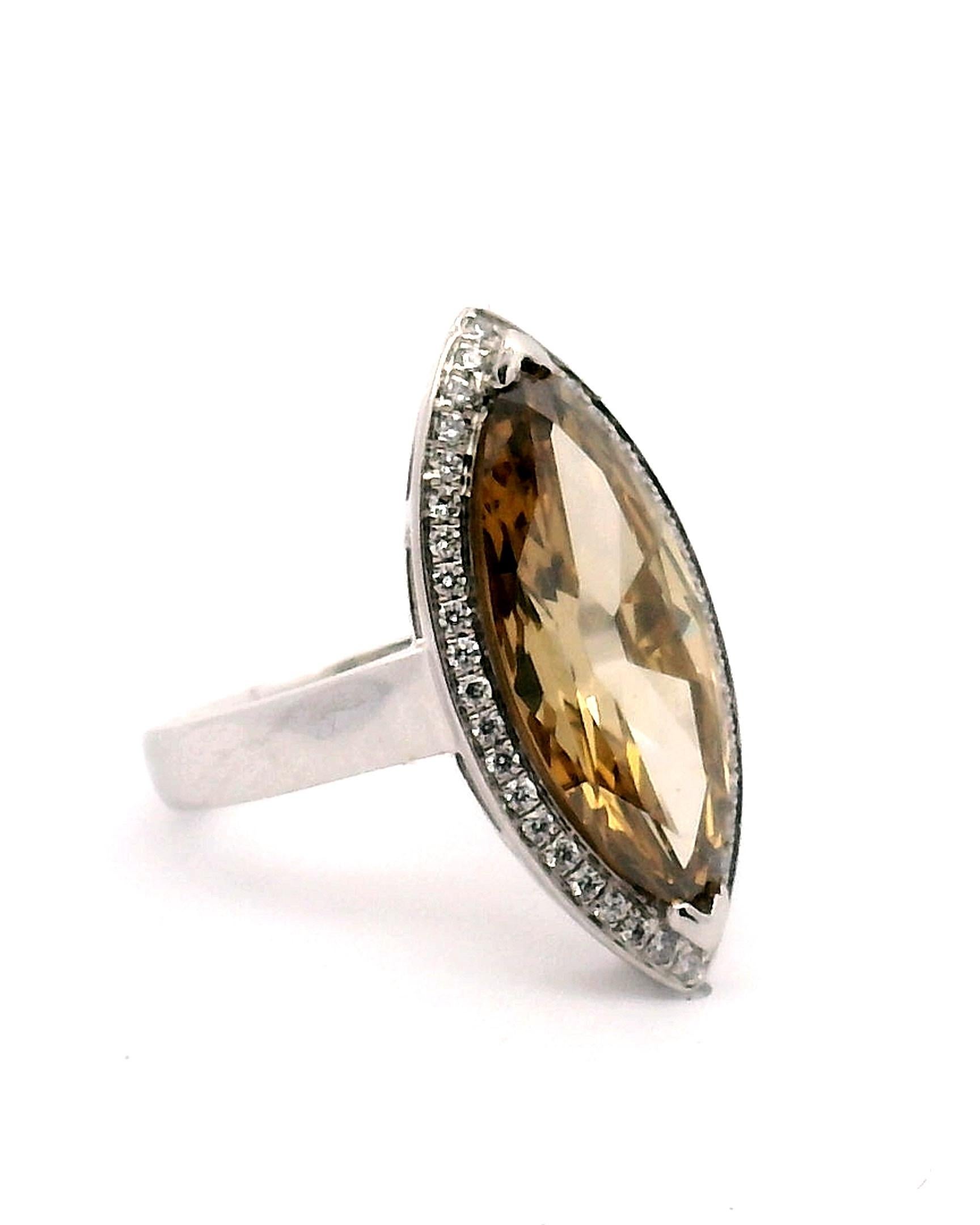 Lady's platinum engagement ring, with Yellow-Brown marquise shape diamond and a diamond halo around the center diamond.

Center marquise cut diamond approximately 4.55ct. 

Clarity grade is VS2

Color grade is G-H

Halo has 42 round brilliant cut