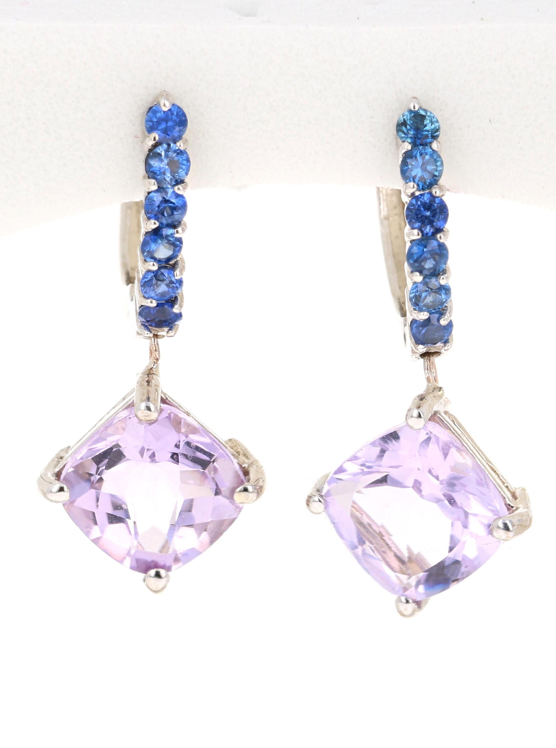 Amethyst and Blue Sapphire Drop Earrings! 

These stunning earrings have 2 Amethysts that weigh 4.02 Carats and are embellished with 12 Blue Sapphires that weigh 0.54 Carats. The total carat weight of the earrings are 4.56 Carats. 

They are