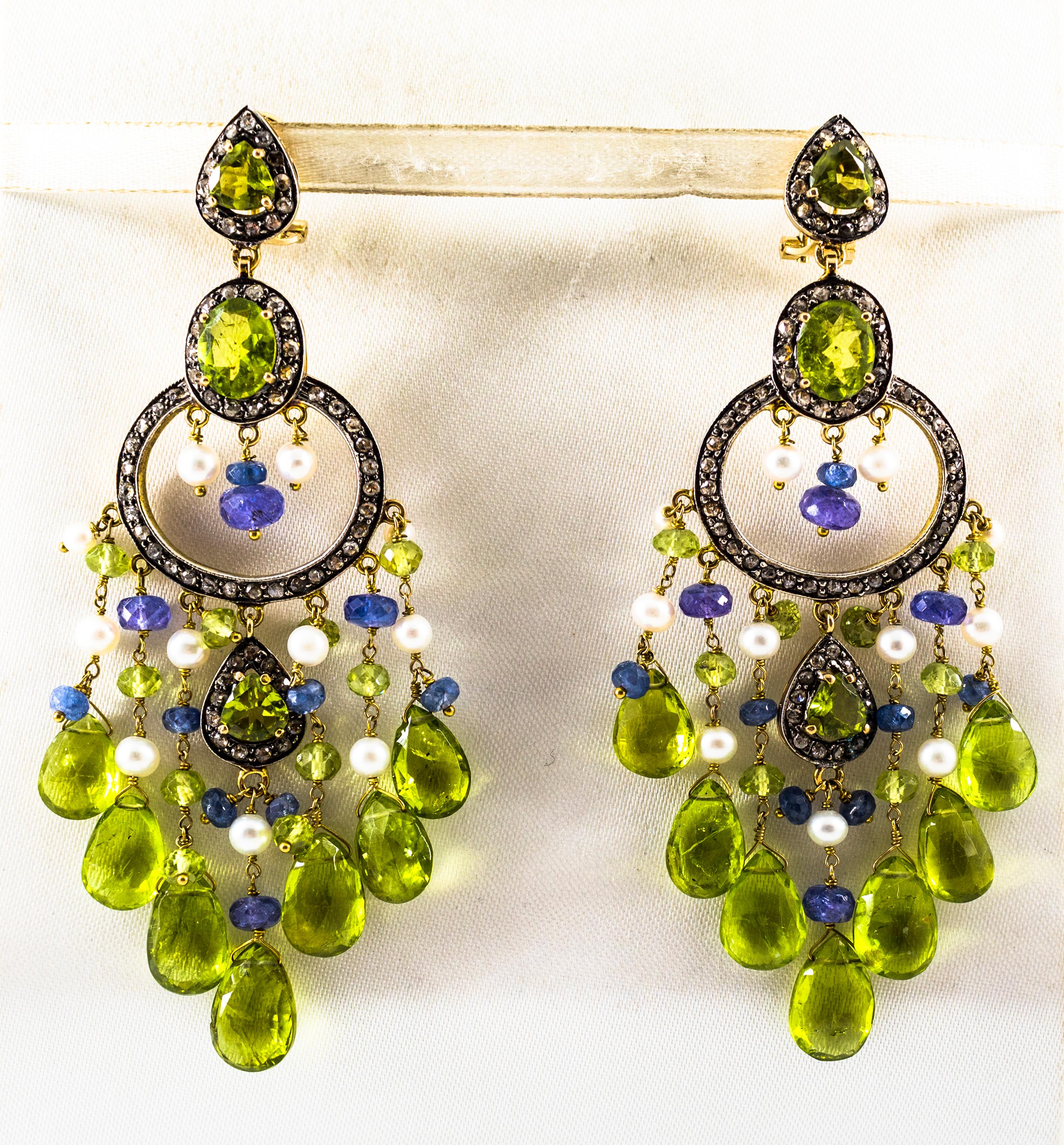 These Earrings are made of 9K Yellow Gold and Sterling Silver.
These Earrings have 2.65 Carats of White Rose Cut Diamonds.
These Earrings have 4.80 Carats of Tanzanite.
These Earrings have 38.20 Carats of Peridot.
These Earrings have also