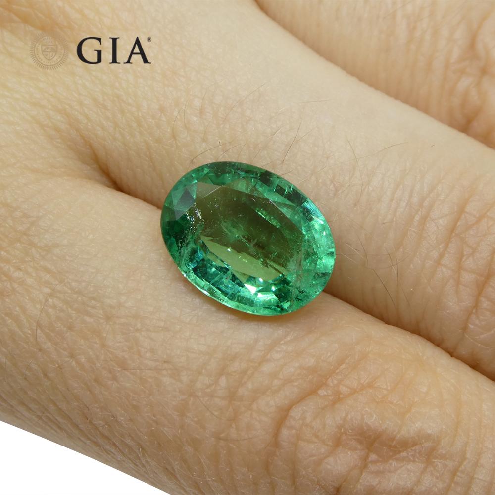 Contemporary 4.56ct Oval Green Emerald GIA Certified Zambia F1/Minor For Sale
