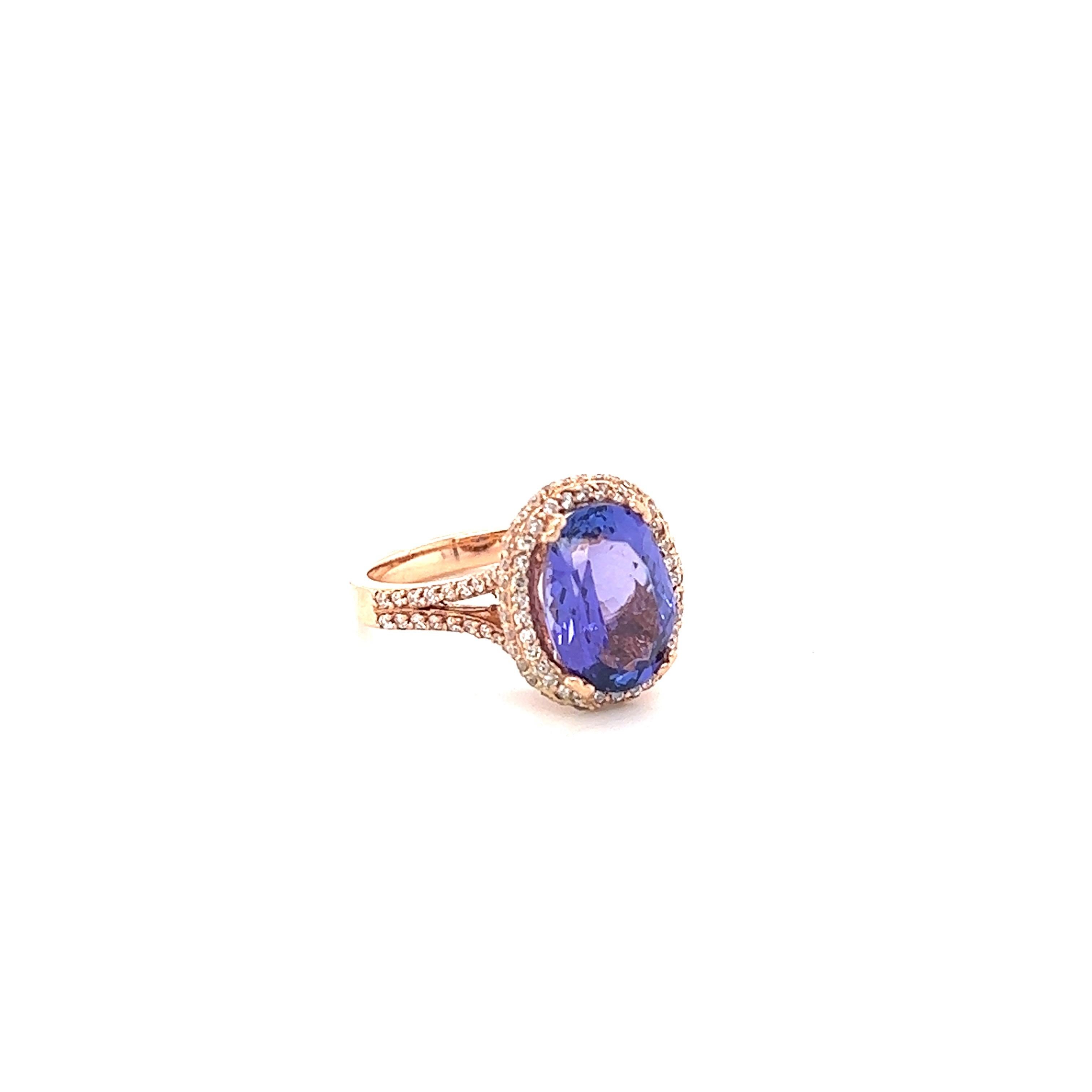 This ring has a radiant purple Oval Cut Natural Tanzanite weighing 3.95 Carats. The Tanzanite measures at 11 mm x 9 mm. It is surrounded by 118 Round Cut Diamonds that weigh 0.62 Carats. The clarity and color of the diamonds are VS-H. The total