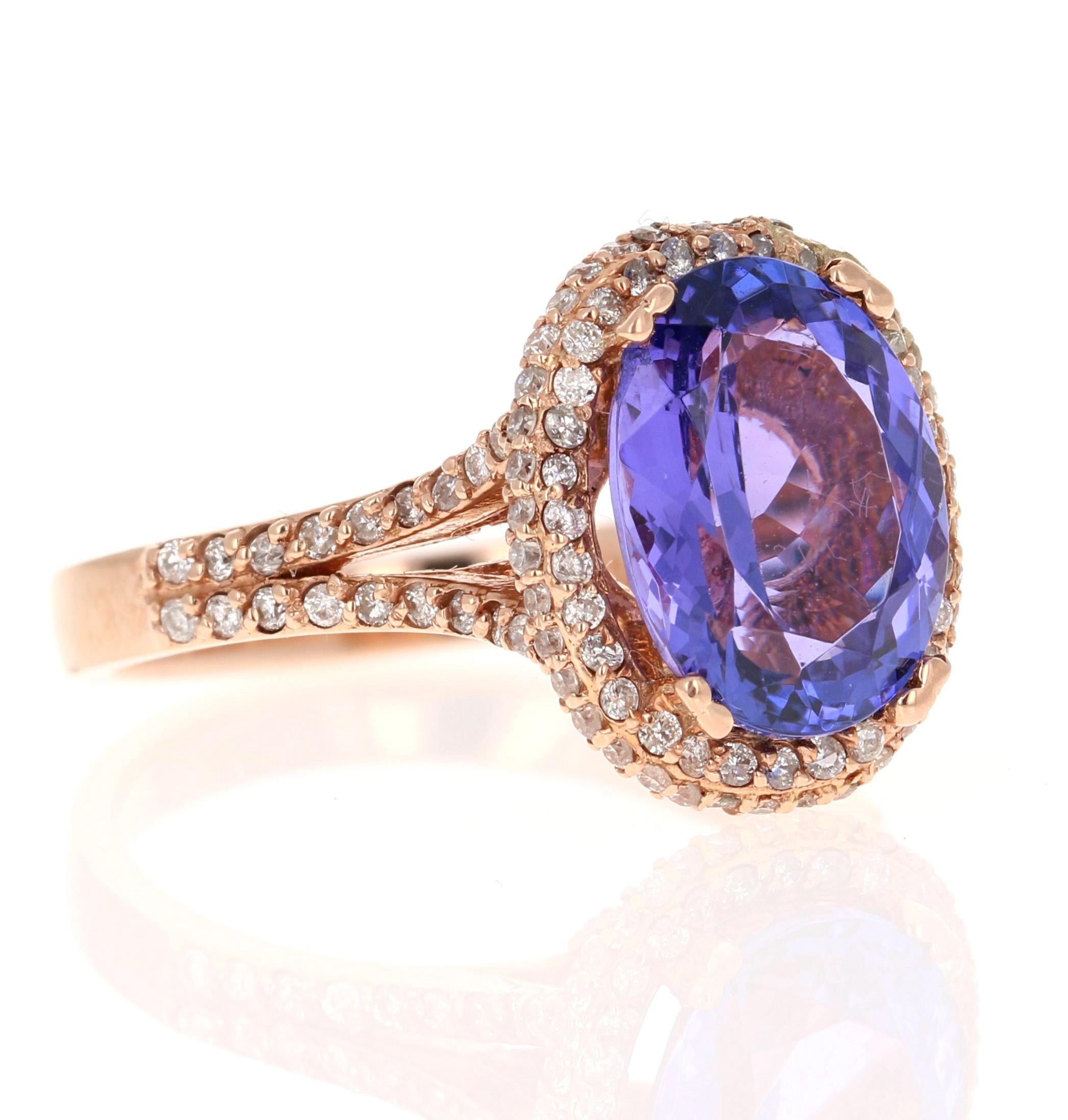 This ring has a radiant purple Oval Cut Natural Tanzanite weighing 3.95 Carats. The Tanzanite measures at 11 mm x 9 mm. It is surrounded by 118 Round Cut Diamonds that weigh 0.62 Carats. The clarity and color of the diamonds are VS-H. The total