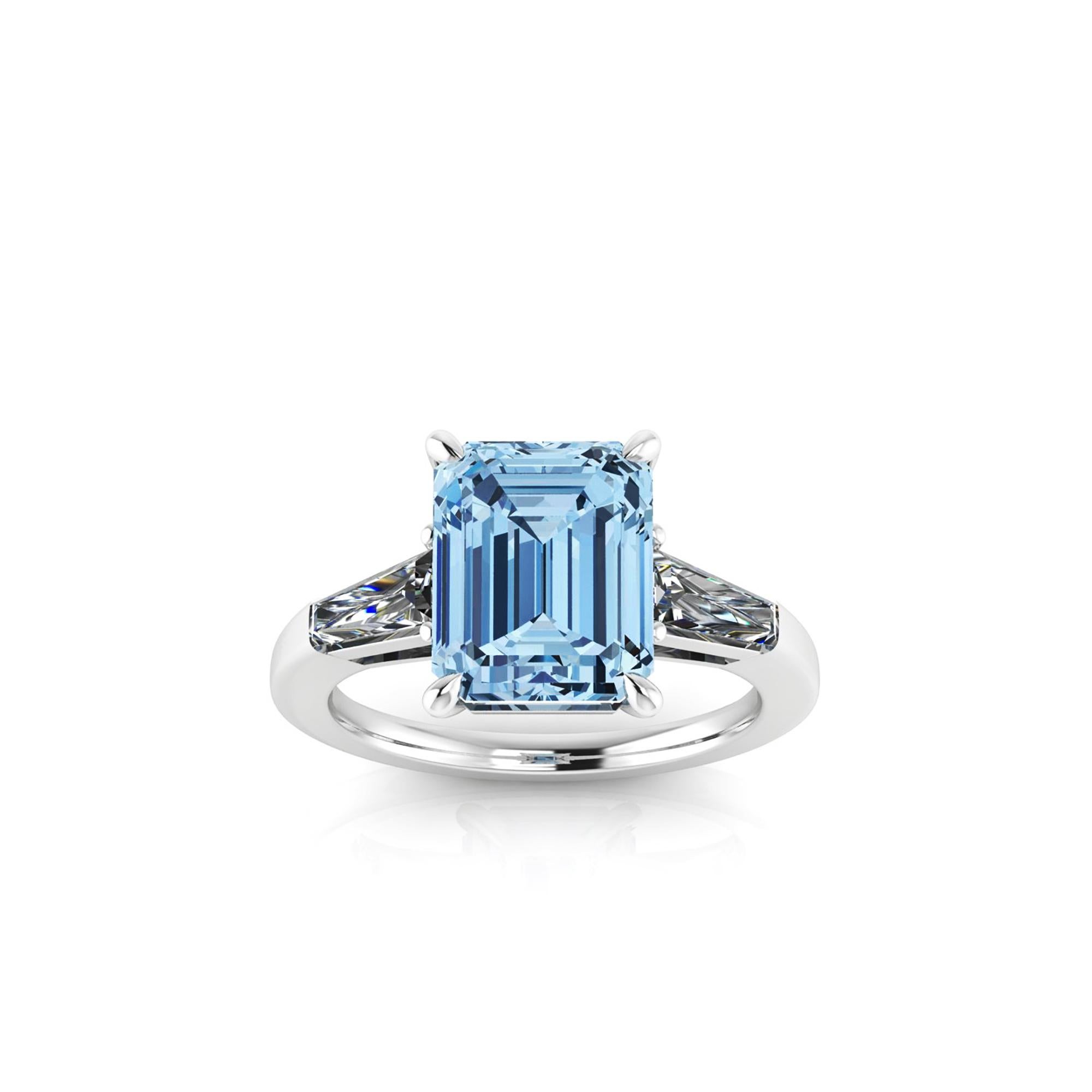 An exquisite 4.61 carat Aquamarine, emerald cut, very high quality color, eye clean gem, accompanied by two, tapered baguette, 0.40 carat total diamonds, G color, Vs clarity, 
set in an hand crafted, delicate and sophisticated looking platinum ring,