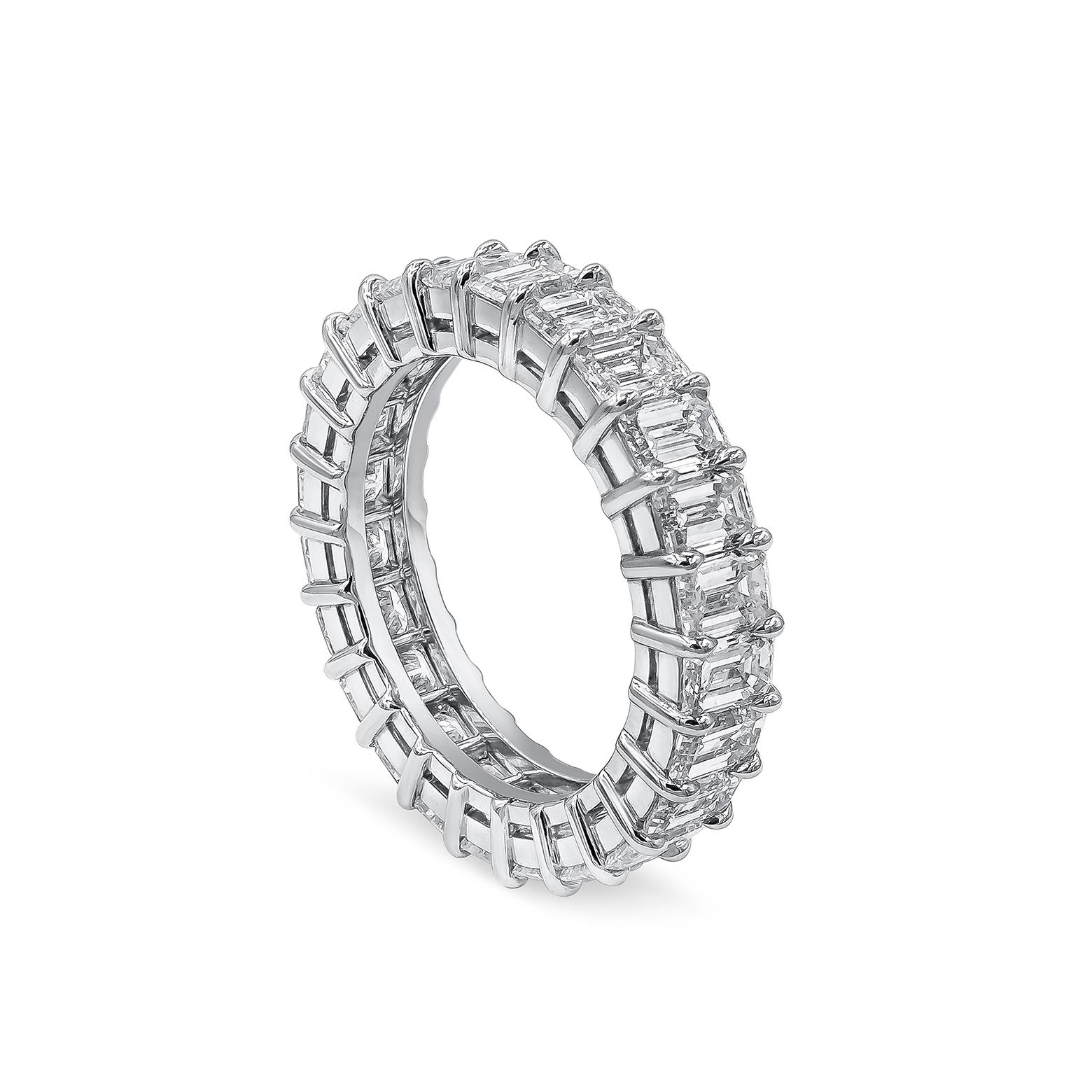 A sophisticated eternity wedding band with emerald cut diamonds weighing 4.58 carats total, set in an open gallery platinum mounting. The diamonds are approximately D-F color and VS clarity. Size 5.5 US.

Roman Malakov is a custom house,