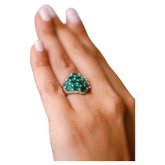 4.58 ct Oval Shaped Emerald and Diamond Accent Cluster Ring in 18 kt White Gold 4.58 ct Oval Shaped Emerald and Diamond Accent Cluster Ring in 18 kt White Gold