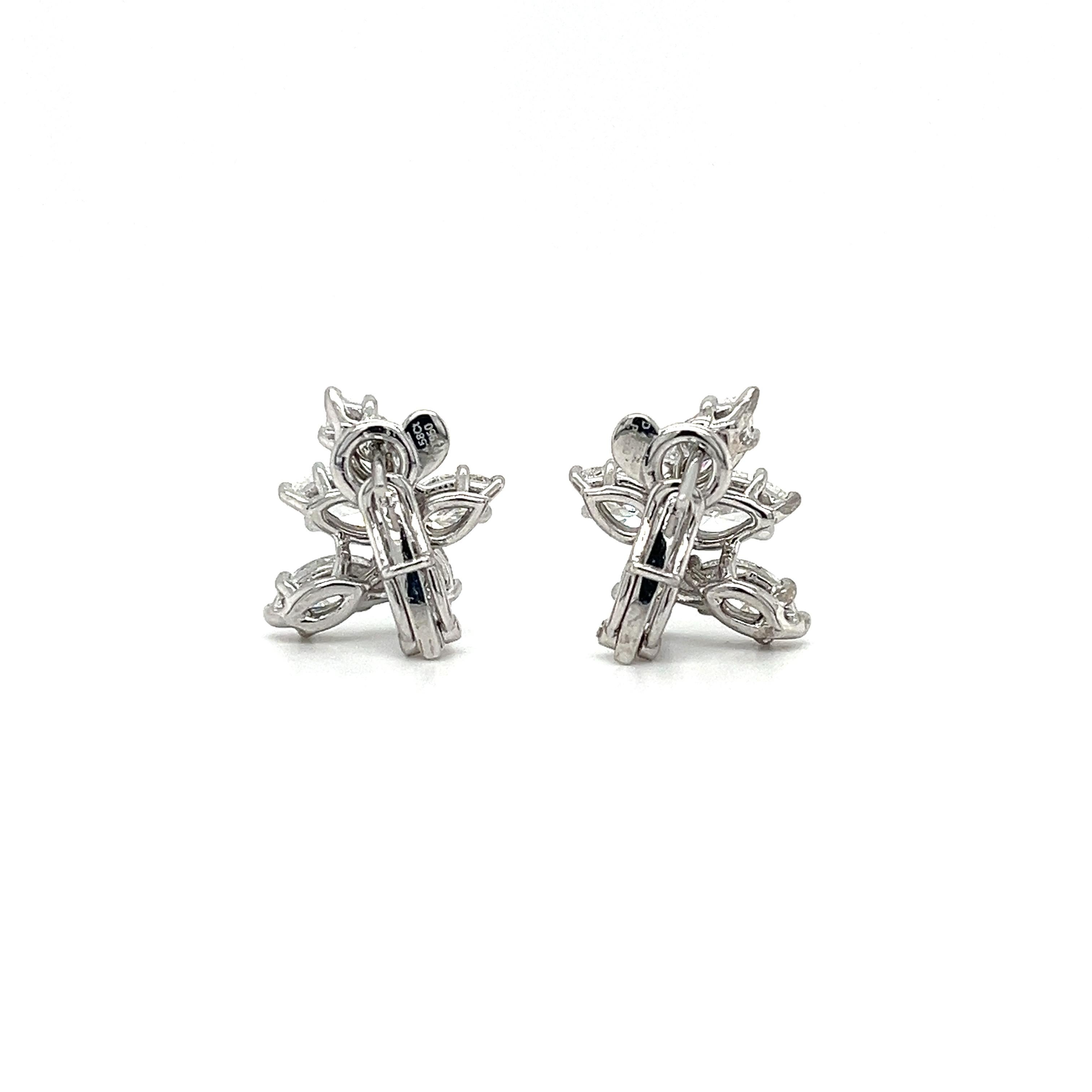 Elevate your style with these stunning platinum clip-on cluster earrings adorned with marquees and pear-shaped diamonds totaling 4.58 carats. The perfect accessory for any occasion. 


F-G Color VS1-VS2 Clarity