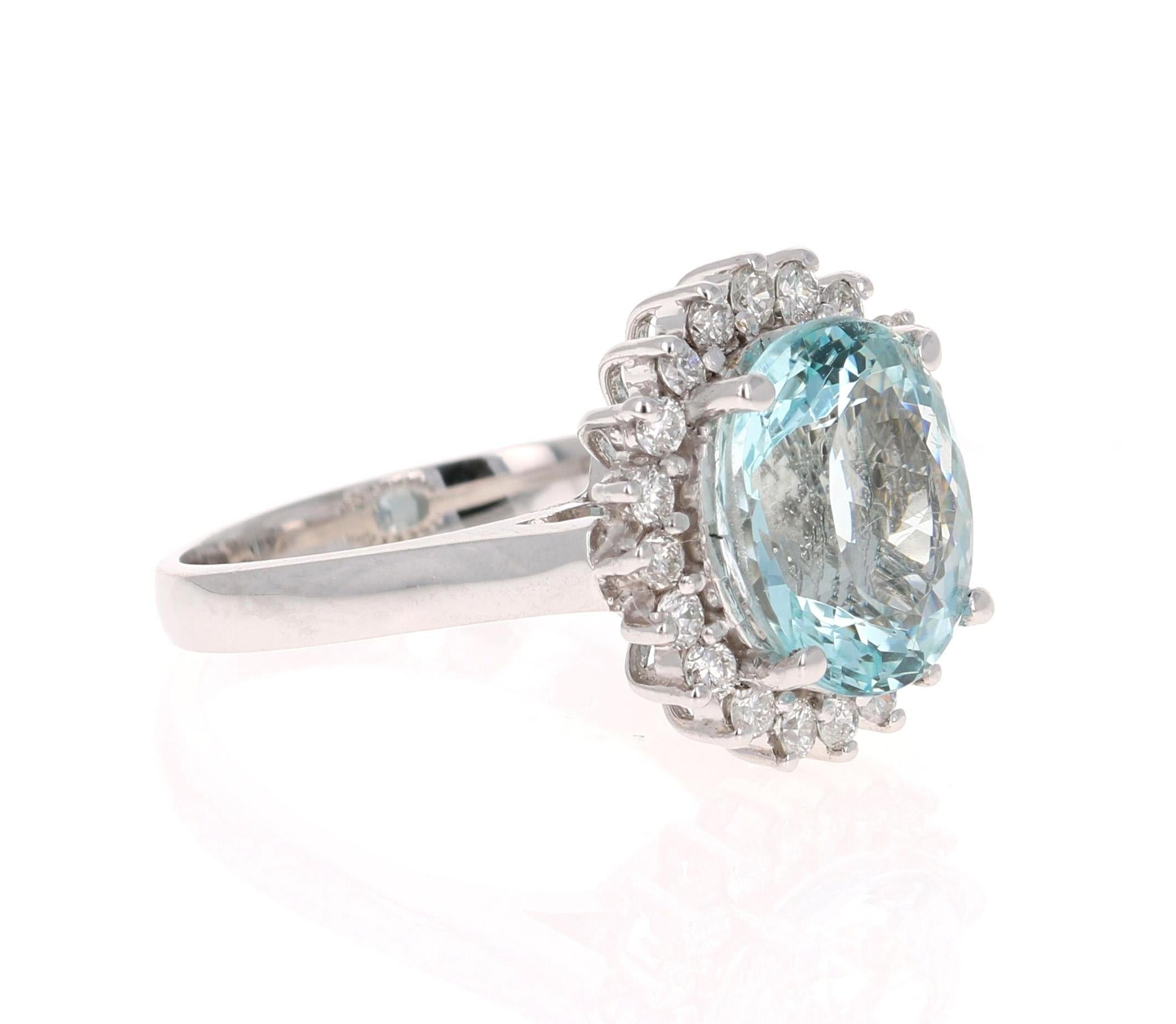 This ring has a beautiful 4.07 Carat Oval Cut Aquamarine and is surrounded by 20 Round Cut Diamonds that weigh 0.52 carat (Clarity: SI, Color: F). The total carat weight of this ring is 4.59 Carats. 

The ring is made in 14K White Gold and weighs