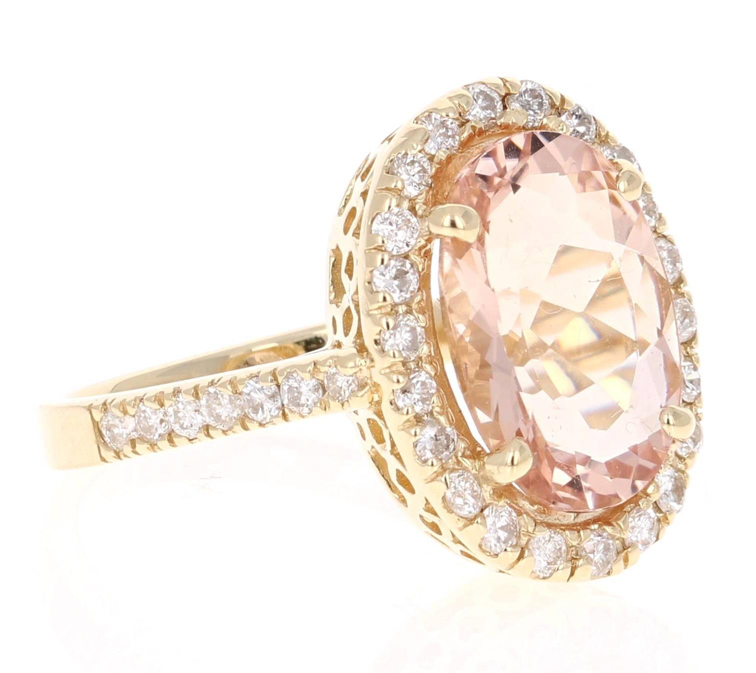 Beautiful and eye-catching 4.59 Carat Oval Cut Morganite Diamond Yellow Gold Cocktail Ring!

This Ring has a 3.95 Carat Oval Cut Morganite in the center of the Ring and is surrounded by 36 Round Cut Diamonds that weigh 0.64 Carats.   The Clarity of