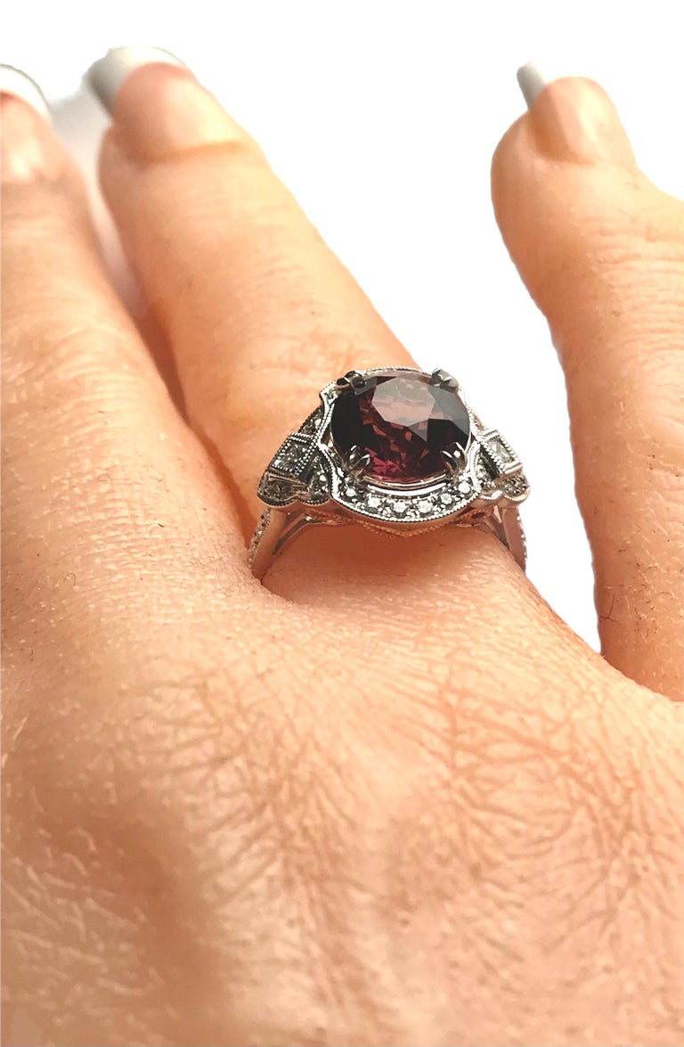 Women's 4.59 Carat Oval Cut Exotic Garnet and Diamond Ring in 18k White Gold For Sale