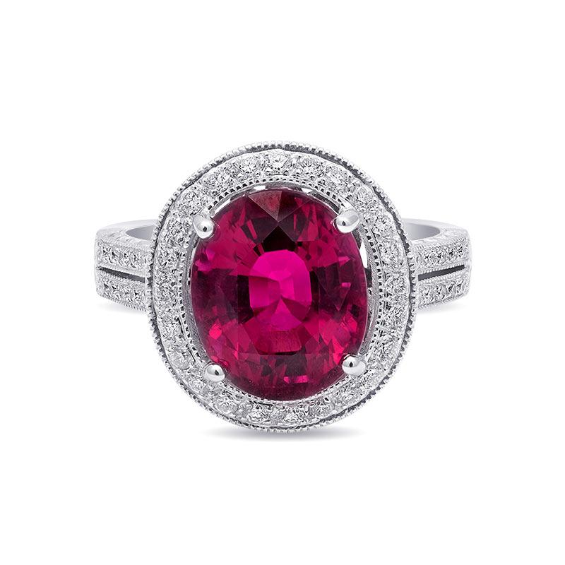 This ring has a warm irresistible glow with its vividly colored 4.59 carat Rubellite Tourmaline. Set in 18K white gold the ring has strong prongs holding the gem in place. With an intricate design, the white gold also has diamonds studded around the