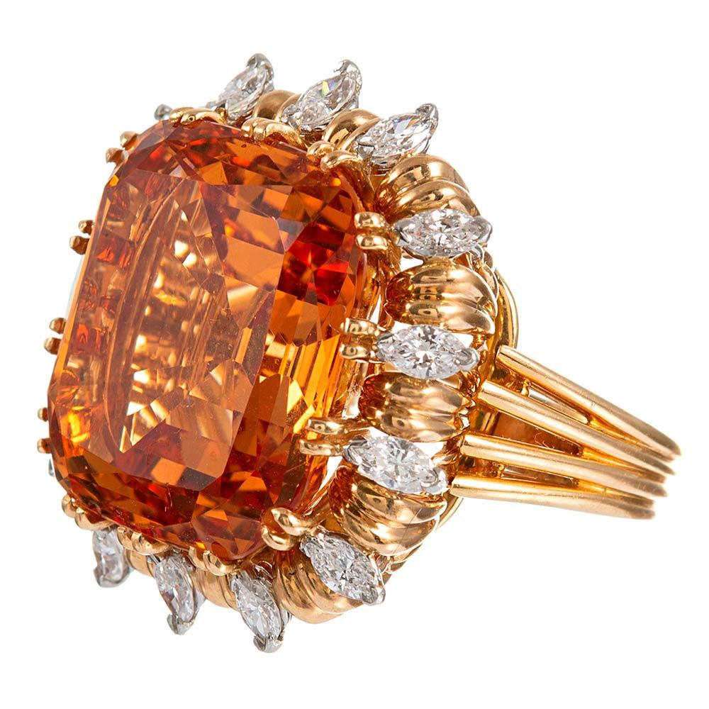 A popular mid-century concept in fine jewelry, the “ring dent” is a modular, convertible piece of jewelry that can be worn as ring or pendant, thus augmenting the occasions to don your finery. This piece boasts an exceptional 45.91 carat unheated