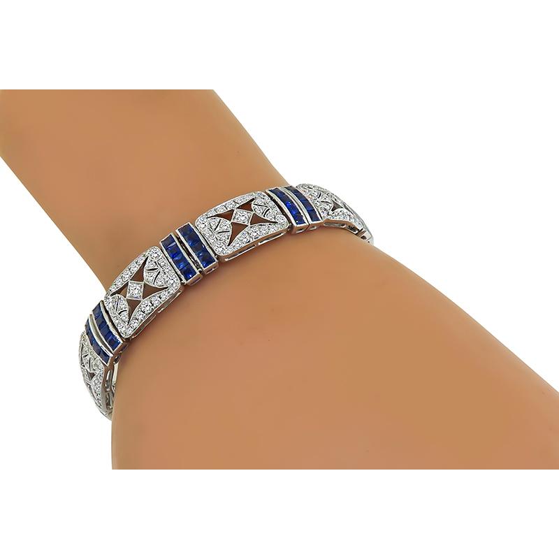 This is an amazing 18k white gold bracelet. The bracelet is set with sparkling round cut diamonds that weigh approximately 4.59ct. The color of these diamonds is H with VS2 clarity. The diamonds are accentuated by lovely square French cut sapphires