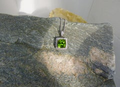 4.5ct. Cushion Cut Peridot and Diamond Pendant in 14K White Gold.