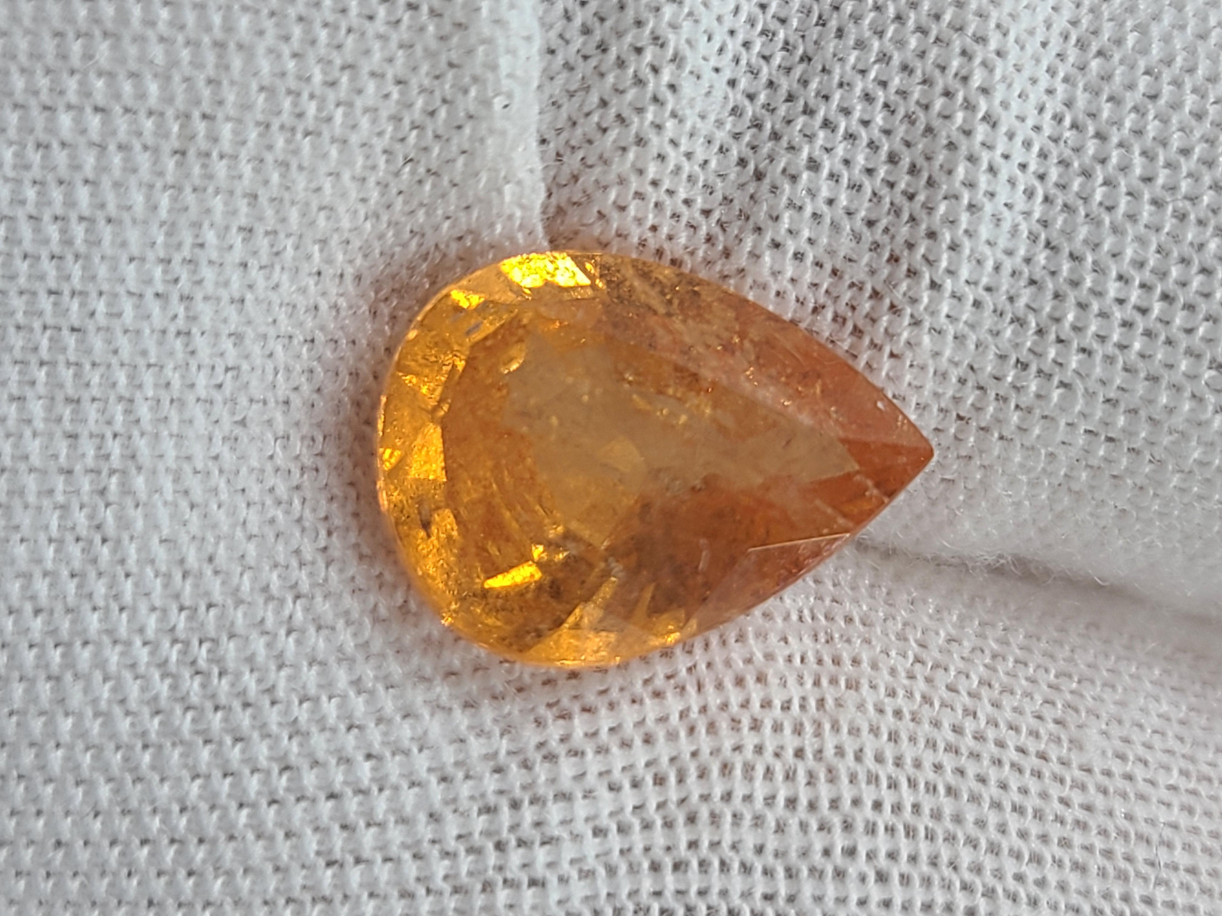 Add this naturally beautiful single loose gemstone to your gemstone collection, or set it into different mounting showcasing its stunning hue.

This pear-shaped spessartine garnet exhibits a deep yellowish-orange, measuring a standard 12mmx9mm with