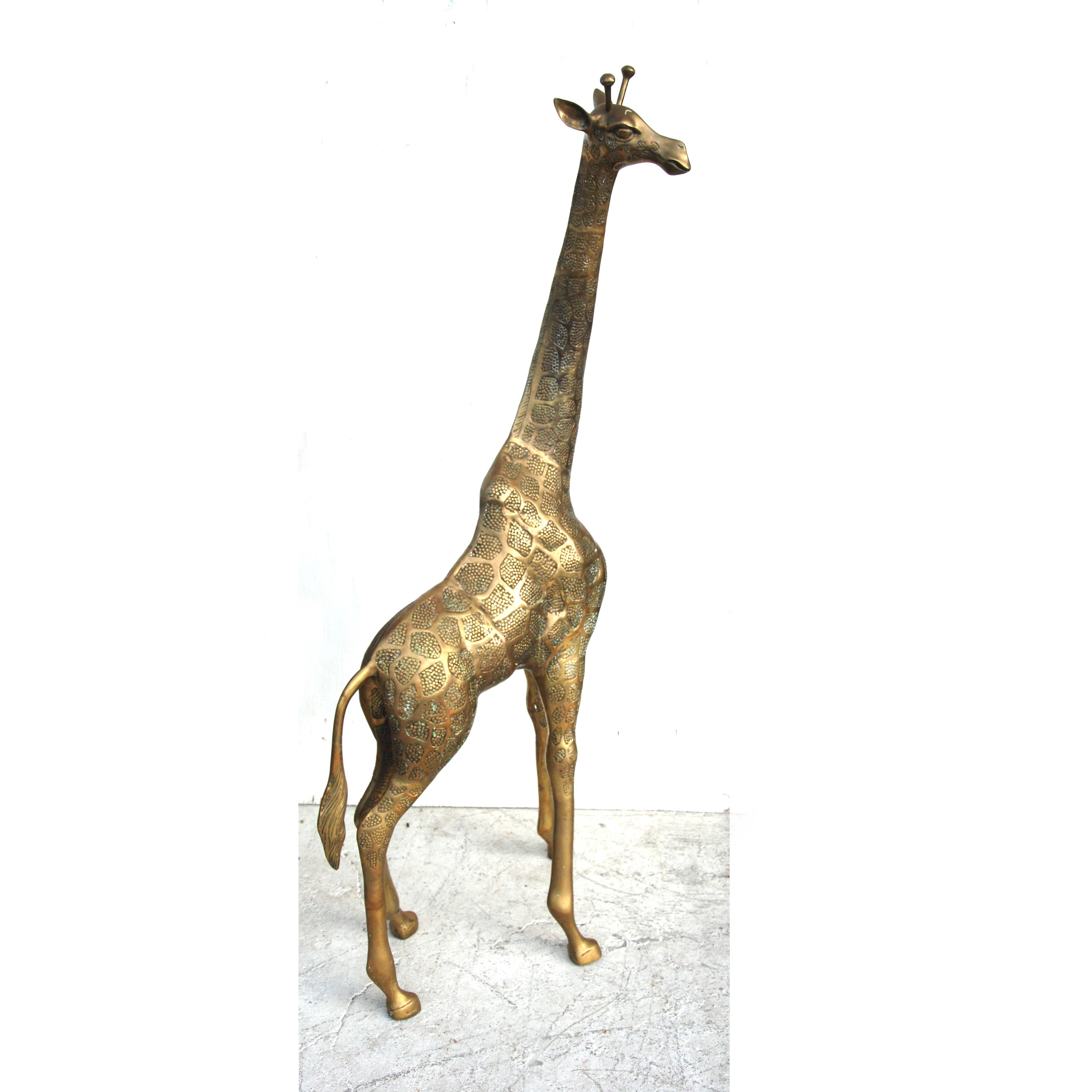 4.5FT Brass Giraffe
 
Hollywood Regency style floor statue, circa 1970s.
 
Standing over 4FT this statue has great presence and details.



            