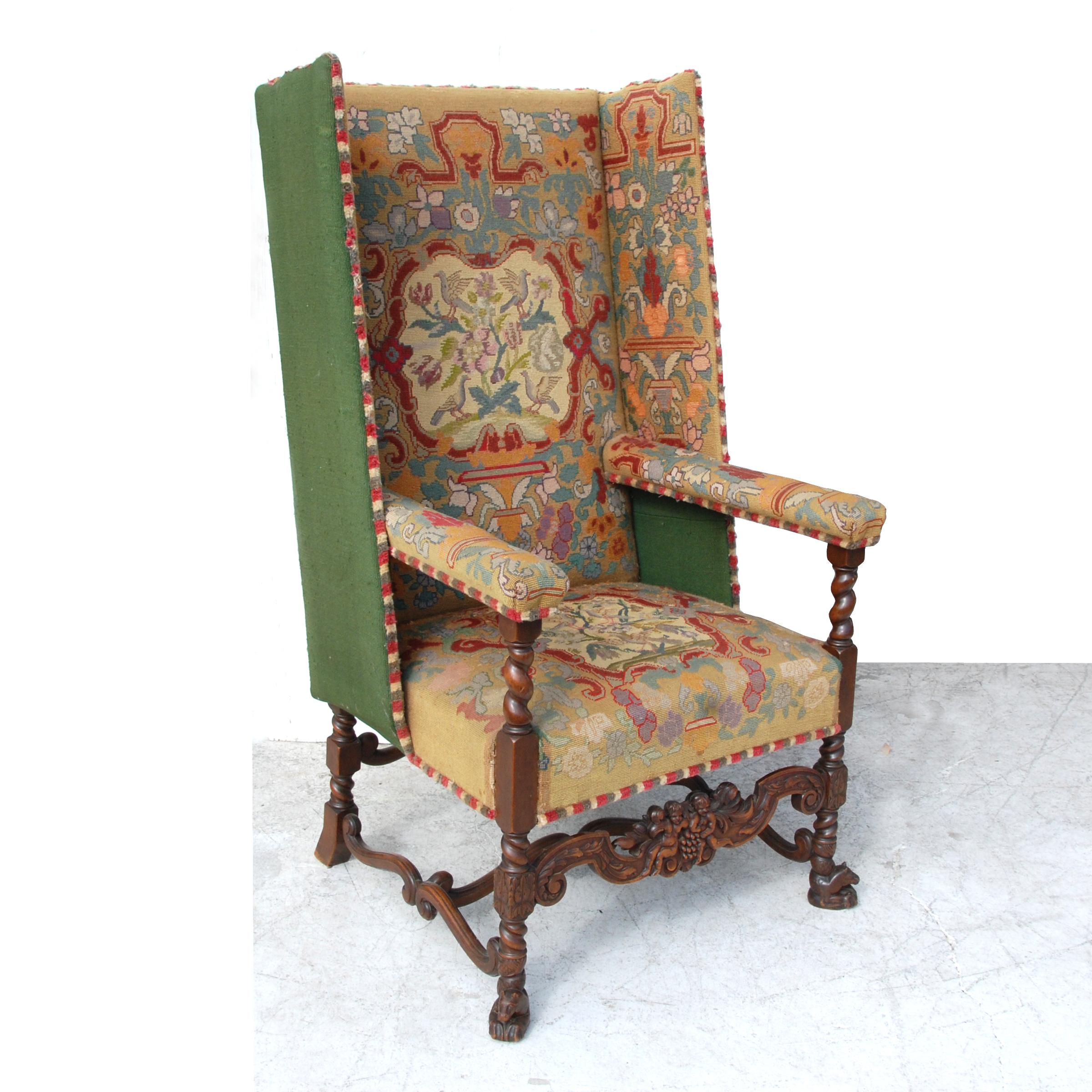 4.5ft needlepoint upholstery wingback armchair

This large armchair features intricate needlepoint upholstery, with detailed cherub and wolf carvings on woodwork. Cherubs line the wooden stretcher, while mythological Hippocampus' are shown on