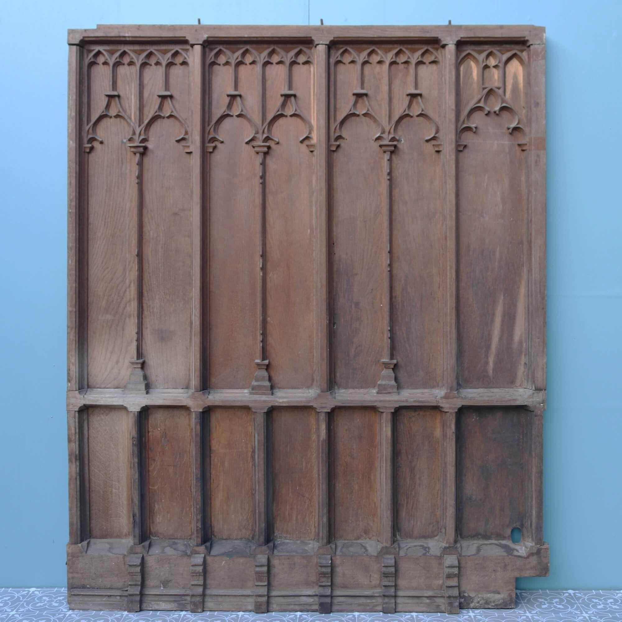 A set of beautifully carved ecclesiastical style English oak wall paneling dating from the late 19th / early 20th century. This reclaimed wall paneling comprises of 3 full height, solid oak panels of varying widths (see below for individual details)