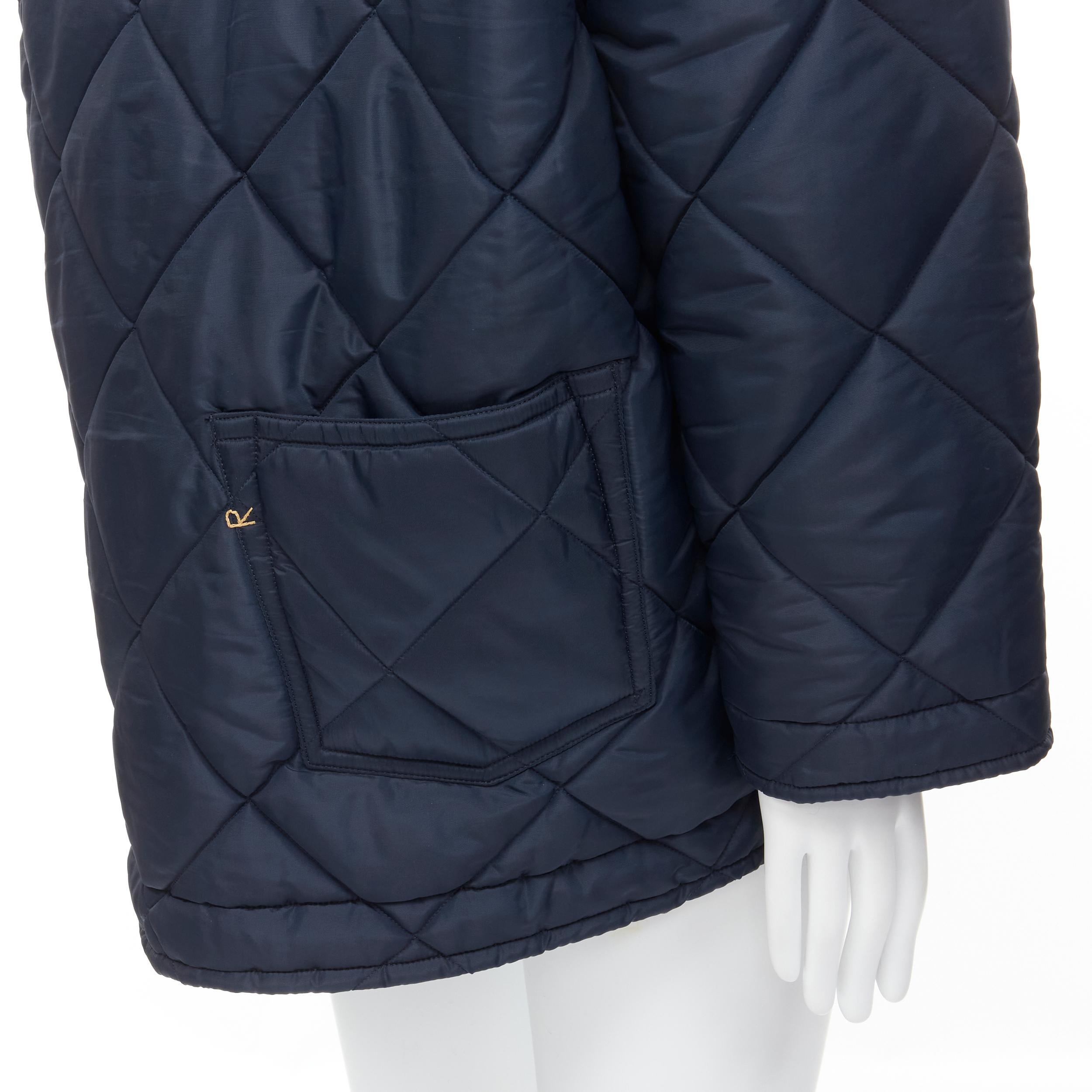 45RPM navy blue polyester padded diamond quilted nylon coat XL 
Reference: CAWG/A00212 
Brand: 45 RPM 
Material: Nylon 
Color: Navy 
Pattern: Solid 
Closure: Zip 
Extra Detail: Concealed zip with button closure. Diamond quilted nylon. Polyester