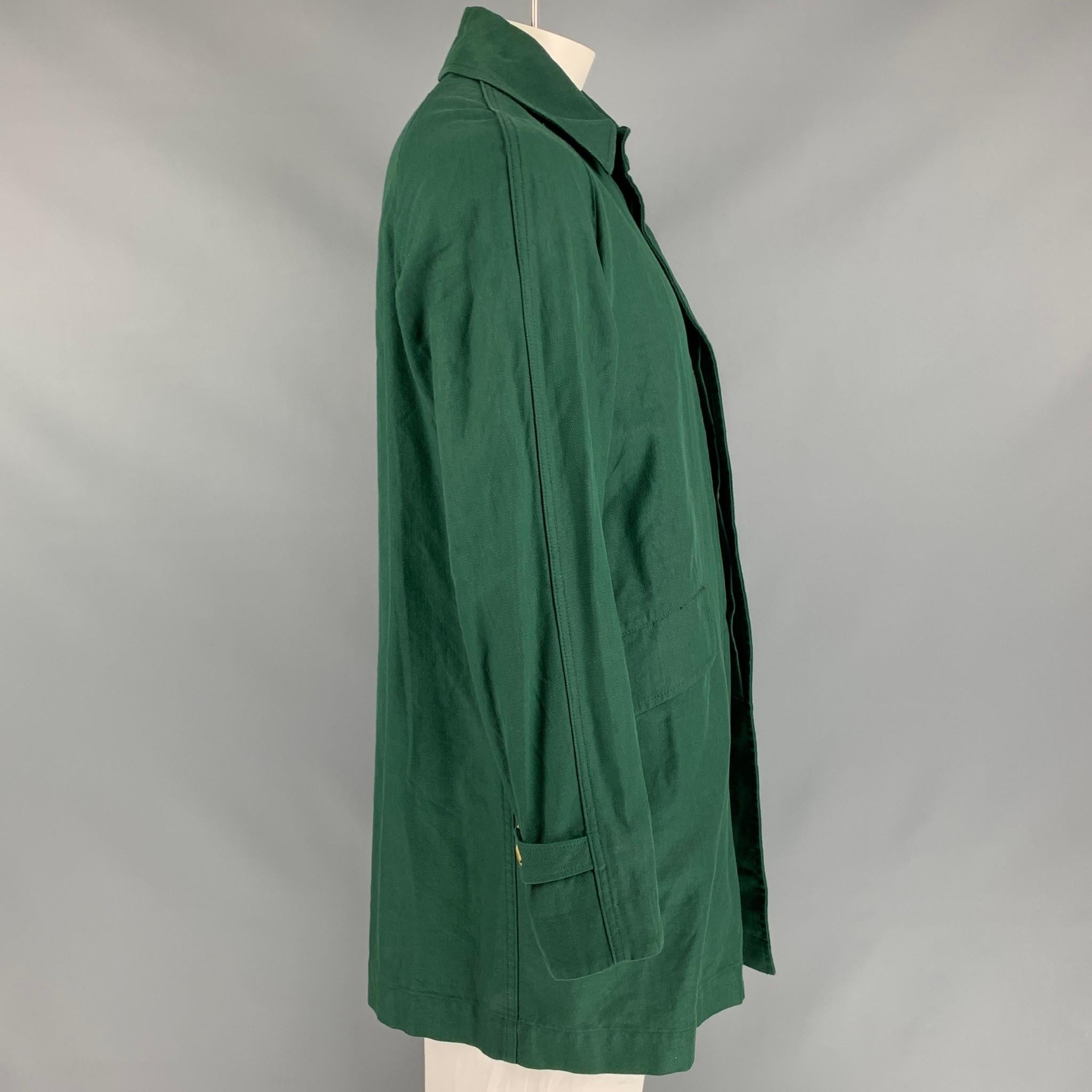 45rpm coat comes in a green cotton featuring a spread collar, buttoned sleeves, flap pockets, loose fit, and a hidden placket closure. Made in Japan. 

New With Tags. 
Marked: 3
Original Retail Price: $832.00

Measurements:

Shoulder: 16 in.
Chest:
