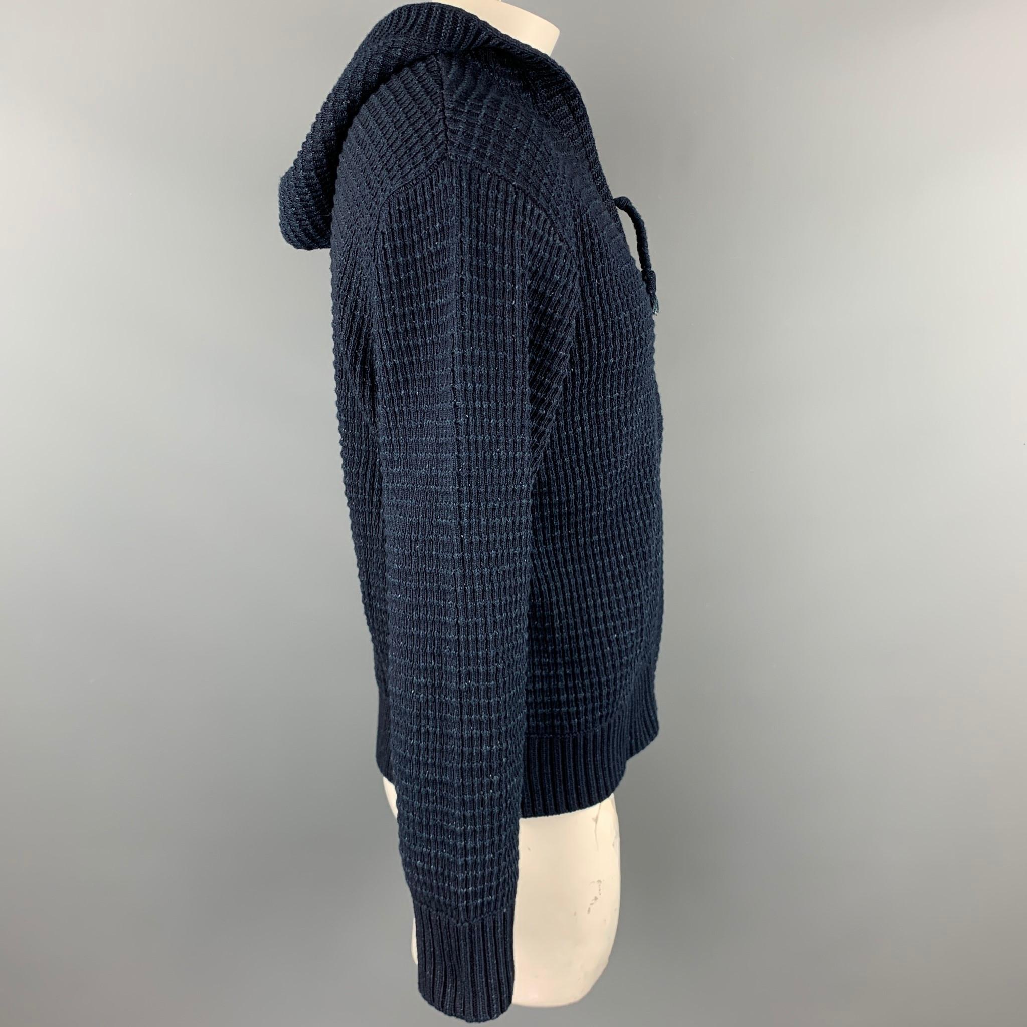 45rpm jacket comes in a navy ribbed cotton featuring a hooded style and a zip up closure. 

Excellent Pre-Owned Condition.
Marked: 5
Original Retail Price: $928.00

Measurements:

Shoulder: 21 in. 
Chest: 44 in. 
Sleeve: 24 in. 
Length: 25.5 in. 
