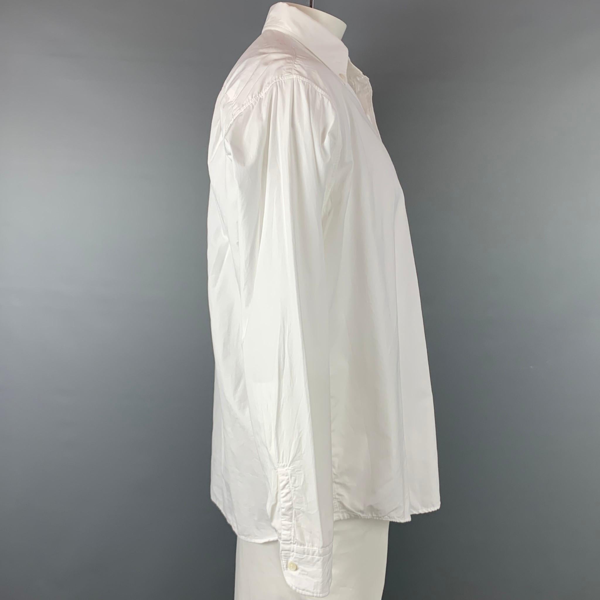 45rpm long sleeve shirt comes in a white cotton featuring a button down style, top stitching, and a front pocket. Made in Japan.

New With Tags.
Marked: JP 5
Original Retail Price: $636.00

Measurements:

Shoulder: 21 in.
Chest: 52 in.
Sleeve: 26