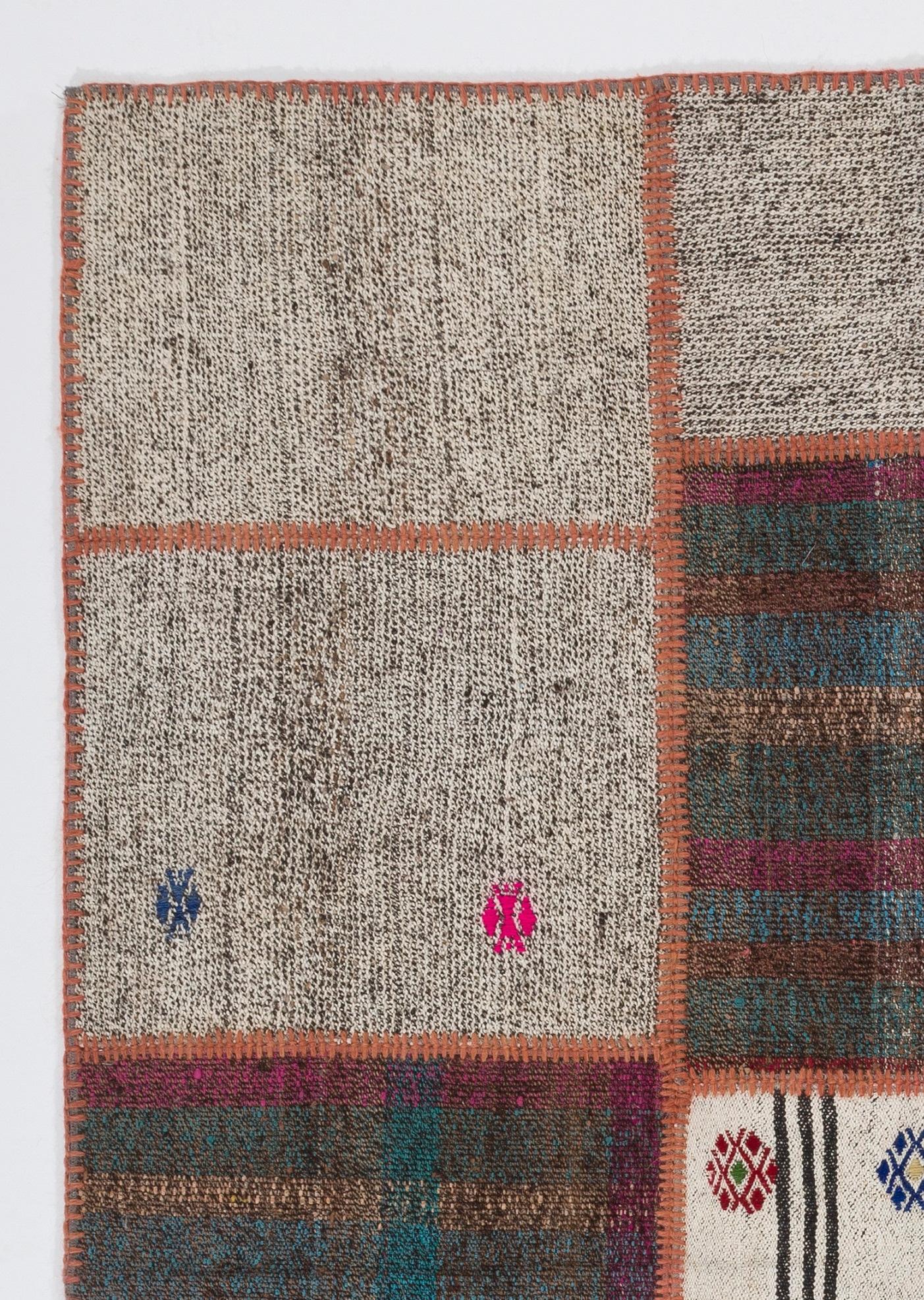 This floor covering is made of pieces of assorted vintage handmade Anatolian kilims. Made of wool and cotton. There is a durable cotton twill sewn on the back as an underlay and for a smooth finishing. Measures: 4.5 x 6.3 ft.
       