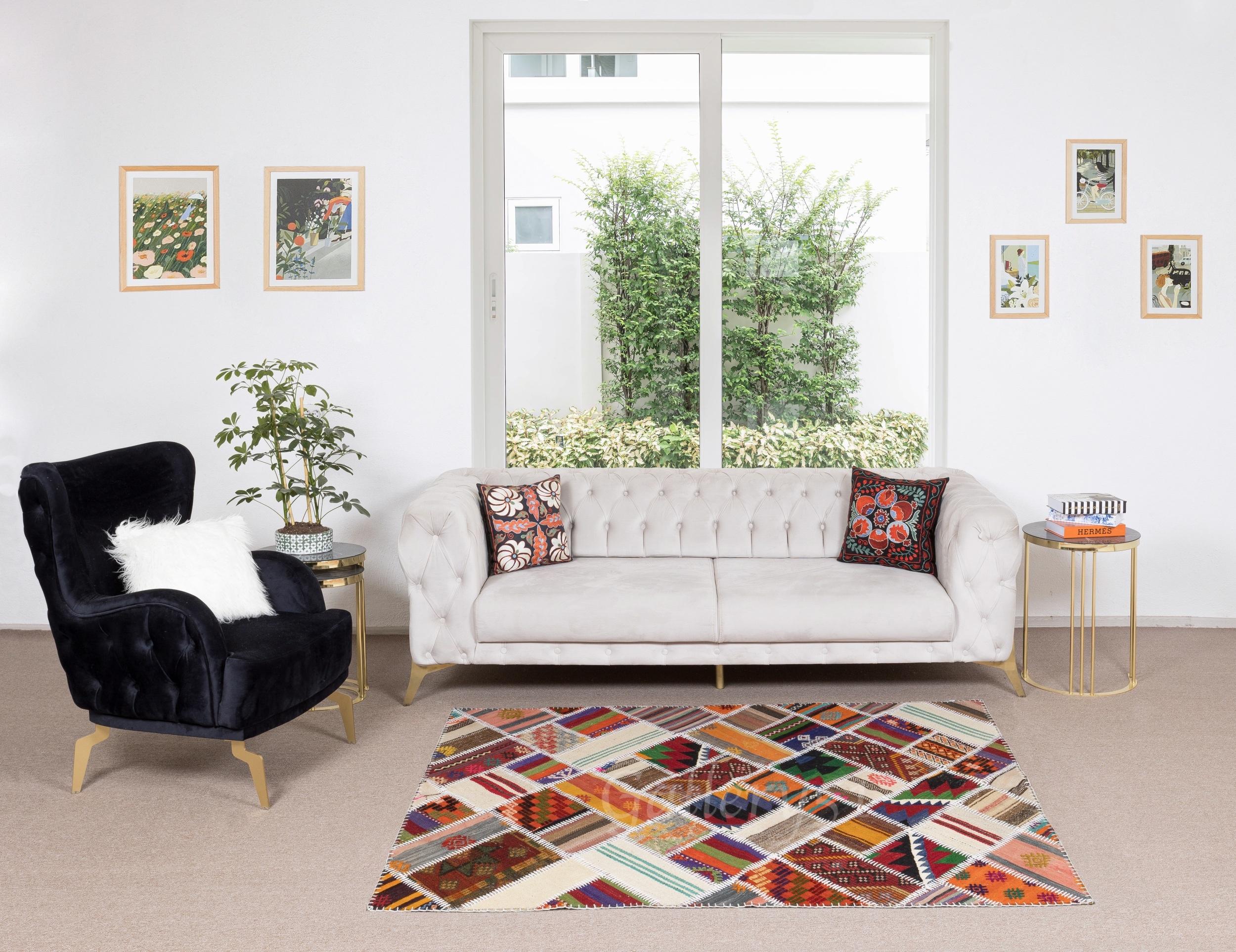This Patchwork rug is hand-made from assorted pieces of vintage Turkish Kilims (flat-woven rugs), it is reinforced with a durable cotton twill/underlay stitched on the back for a smooth finish and extra thickness. The banded kilims used in making