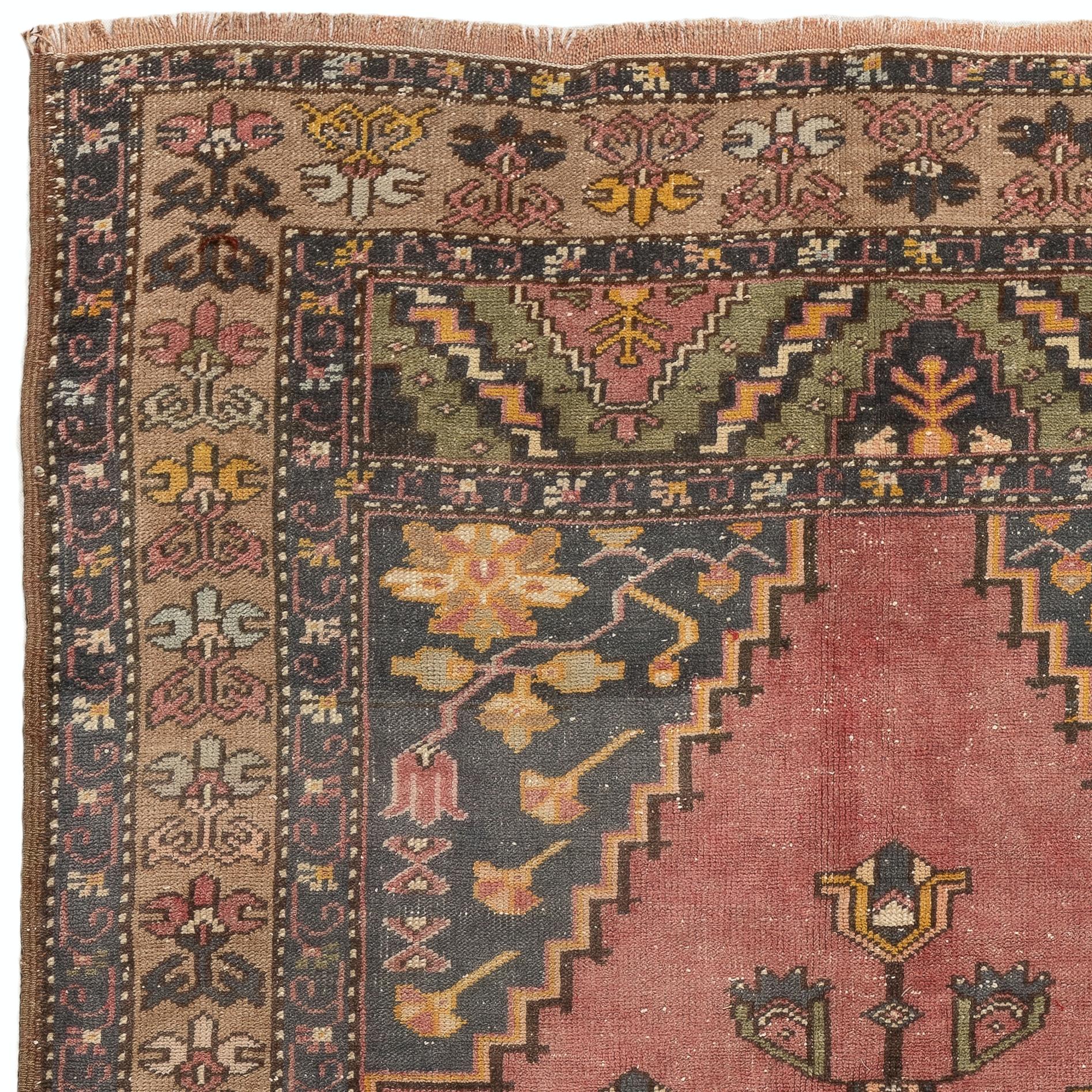 A vintage Turkish village rug with geometric medallion design. Measures: 4.5 x 8.4 ft
The rug is hand-knotted with natural sheep's wool, has soft medium pile, in good condition and sturdy. Its soft and warm color palette has a vibrancy to it that