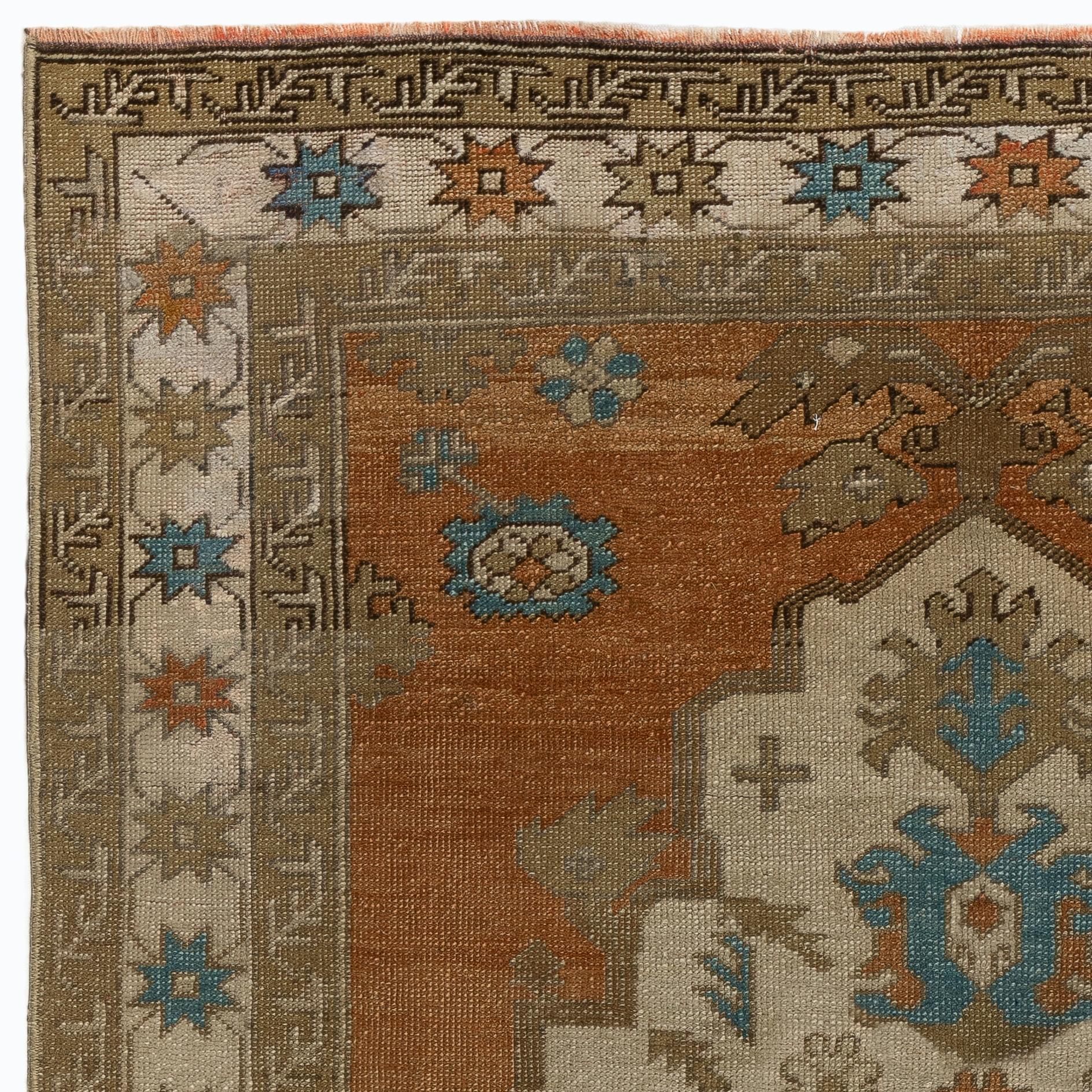 A vintage Turkish area rug with a geometric design and unusual border pattern. Medium Wool pile on wool foundation. Washed professionally. Ideal for both residential and commercial interiors. 
Size: 4.5 x 9.5 ft.
